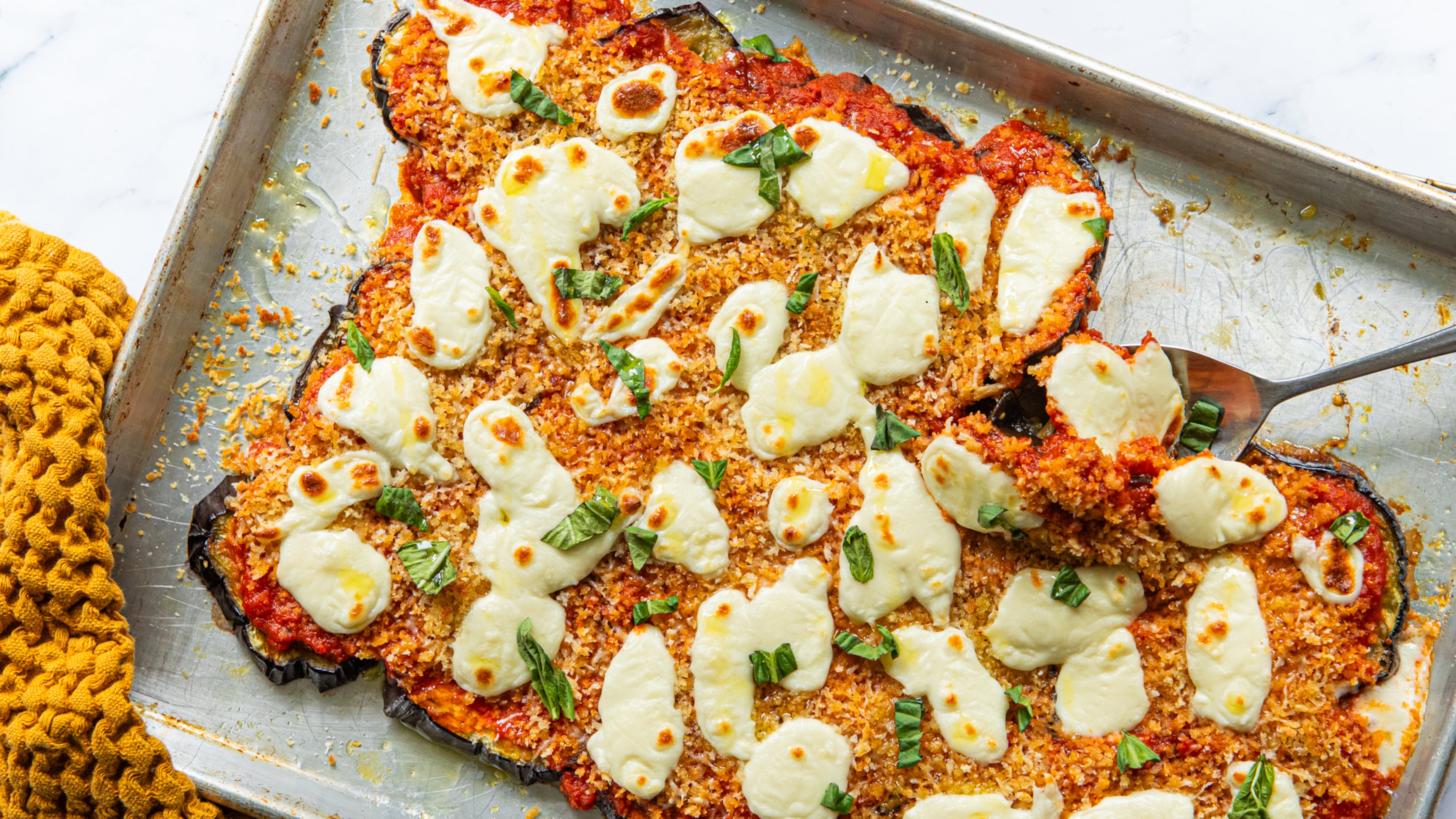It’s possible to get eggplant Parmesan cooked in less than half an hour. You’ll just need to employ a sheet pan and your broiler. (Aaliyah Man for the AJC/food styled by Kate Williams)