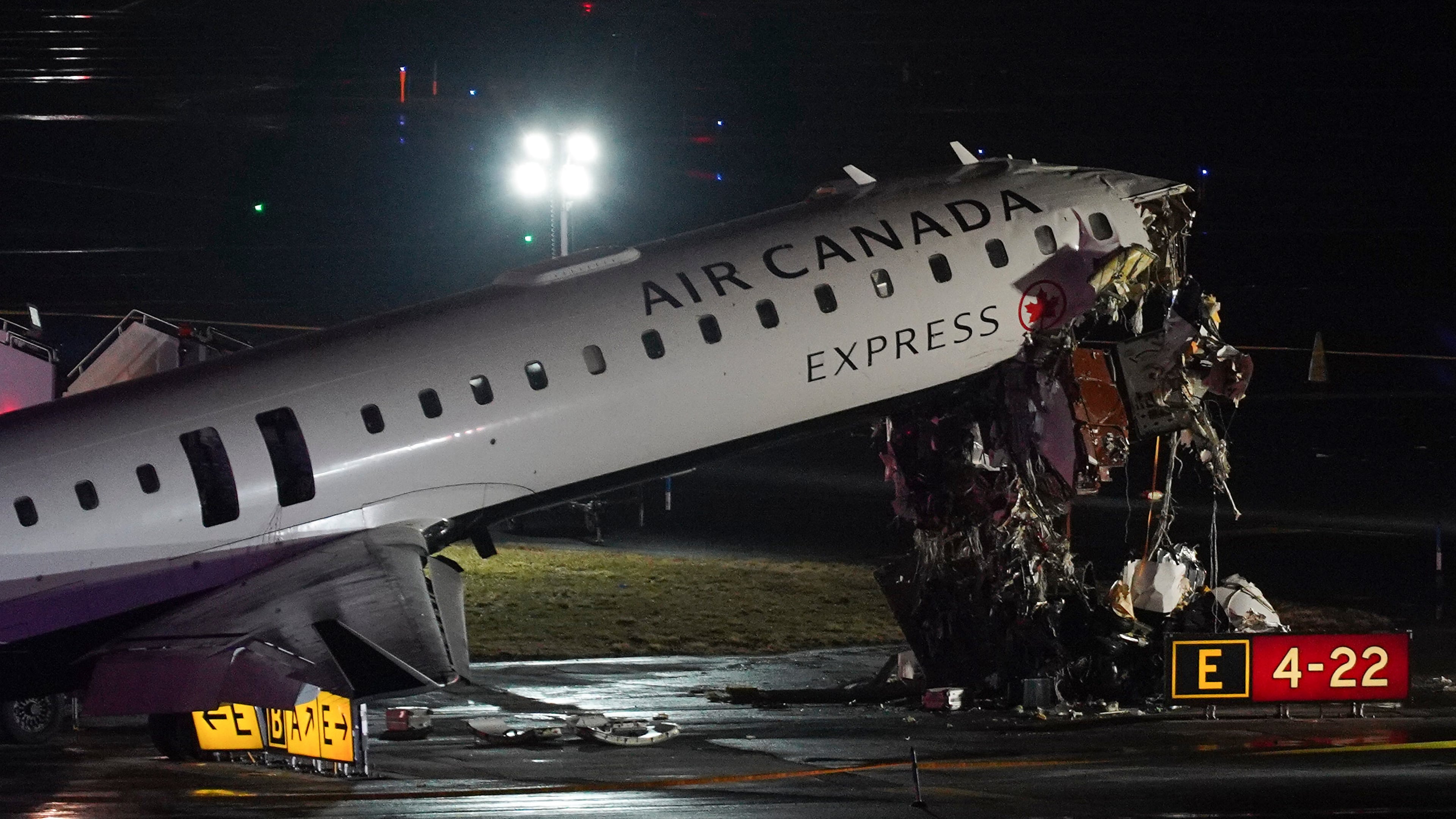 FILE - An Air Canada Jet sits on the runway at LaGuardia Airport, Monday, March 23, 2026, after colliding with a Port Authority aircraft rescue and firefighting vehicle after landing in New York. (AP Photo/Ryan Murphy, File)