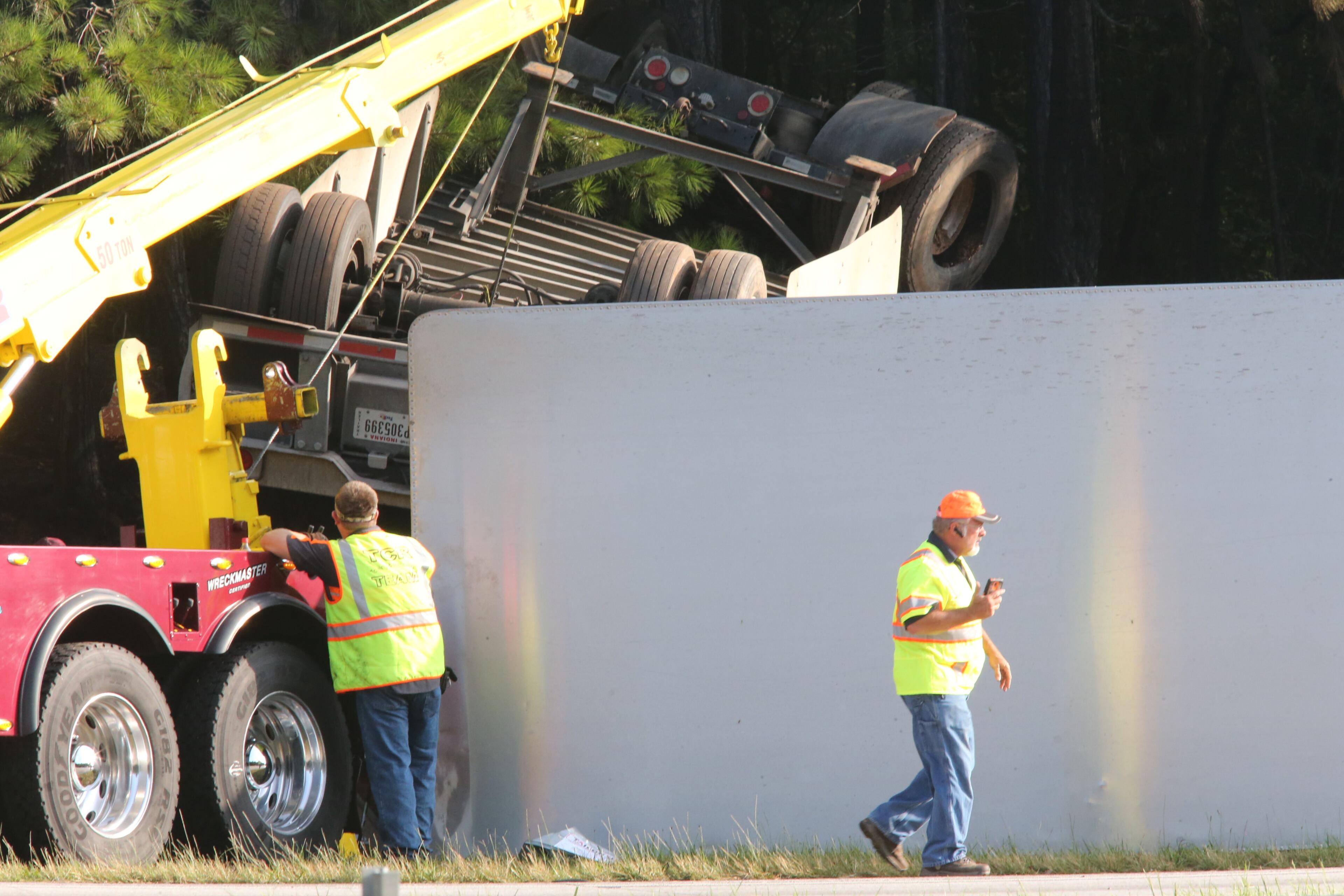 “Initial indications are that it’s a tractor-trailer and some type of bus,” the Georgia State Patrol said in an email. A FedEx truck with tandem trailers was overturned on the right side of the roadway, and the bus overturned and caught fire along the wood line. JOHN SPINK/JSPINK@AJC.COM