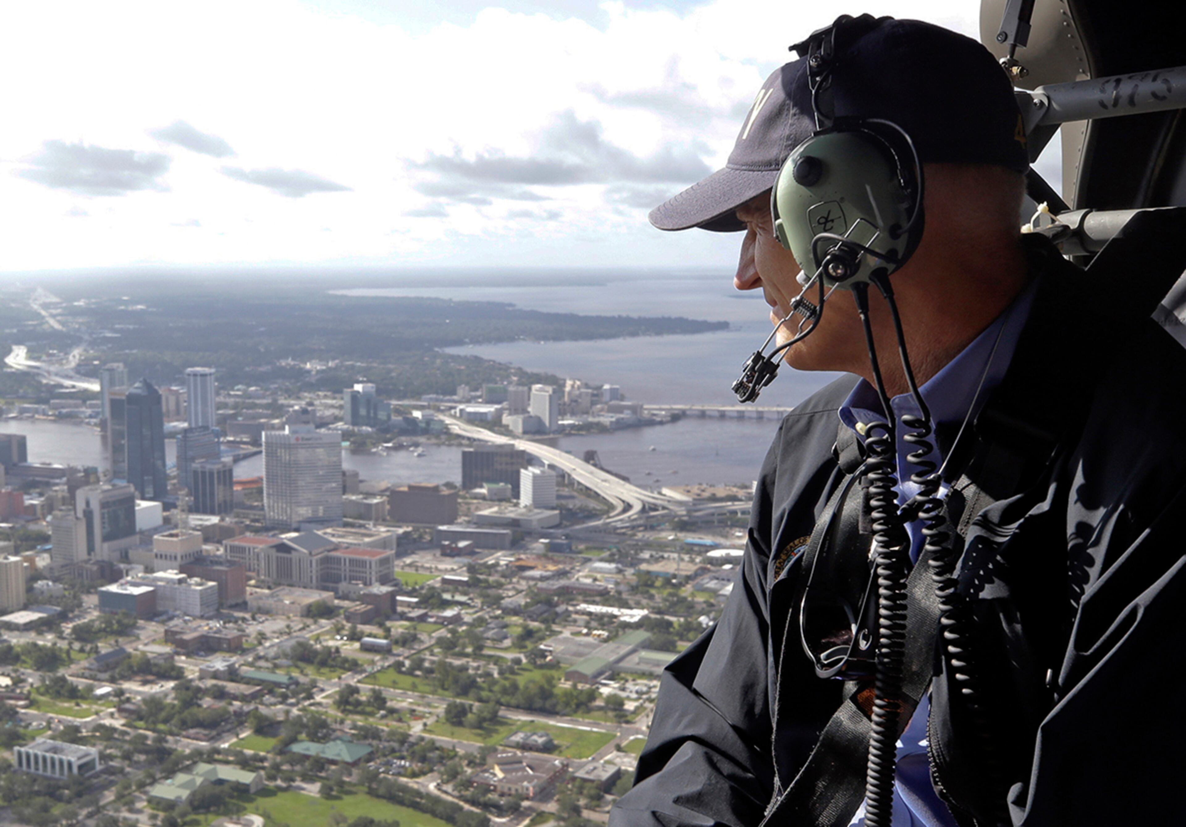 Jacksonville, Fla.: Gov. Rick Scott flies over Jacksonville, Fla., in a military helicopter as he looks at damage to the downtown area during the aftermath of Hurricane Irma on Tuesday, Sept. 12, 2017. (AP Photo/John Raoux)
