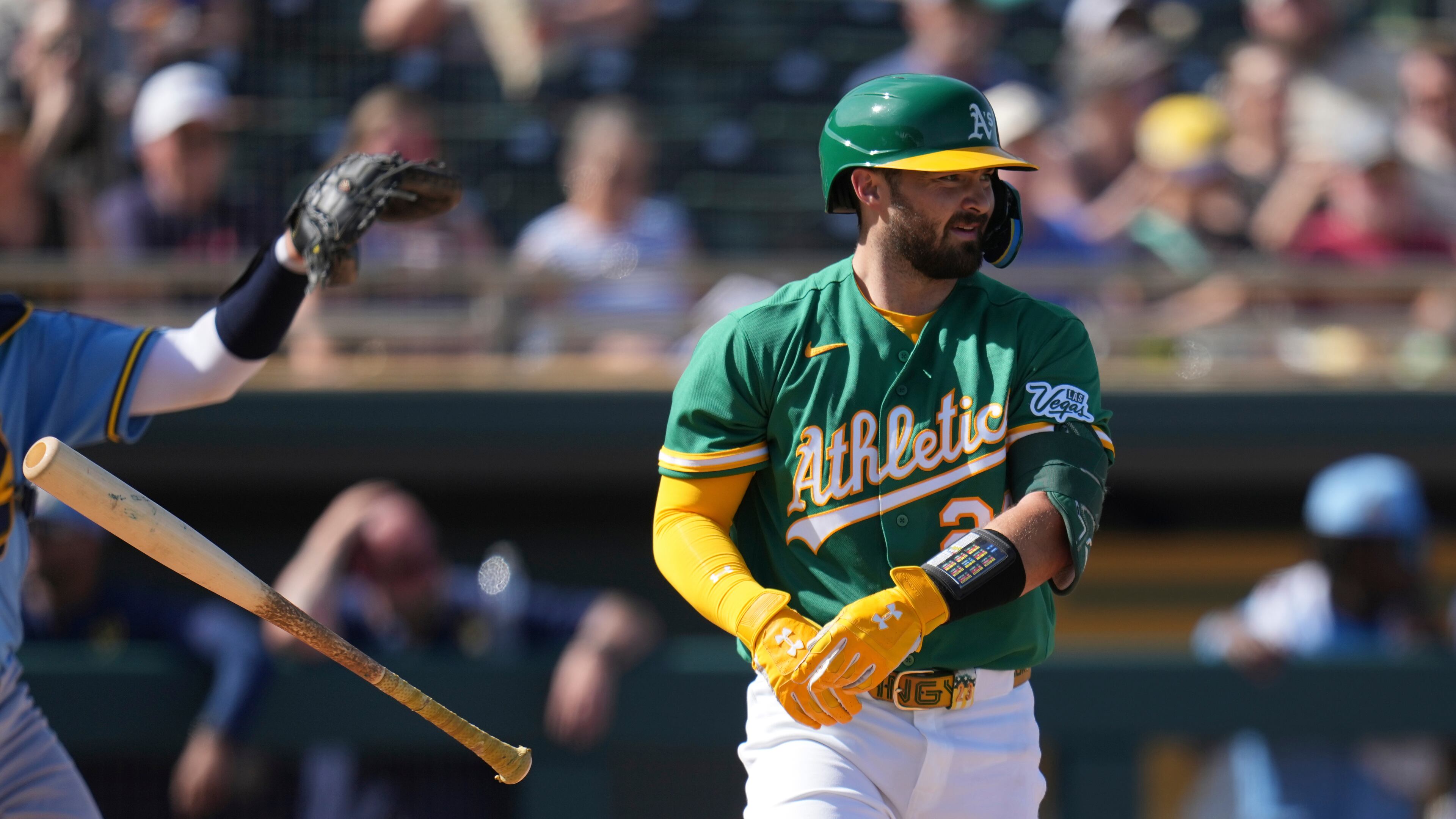 Athletics' Shea Langeliers flips his bat away after earning a walk against the Milwaukee Brewers during the third inning of a spring training baseball game Tuesday, Feb. 24, 2026, in Mesa, Ariz. (AP Photo/Ross D. Franklin)