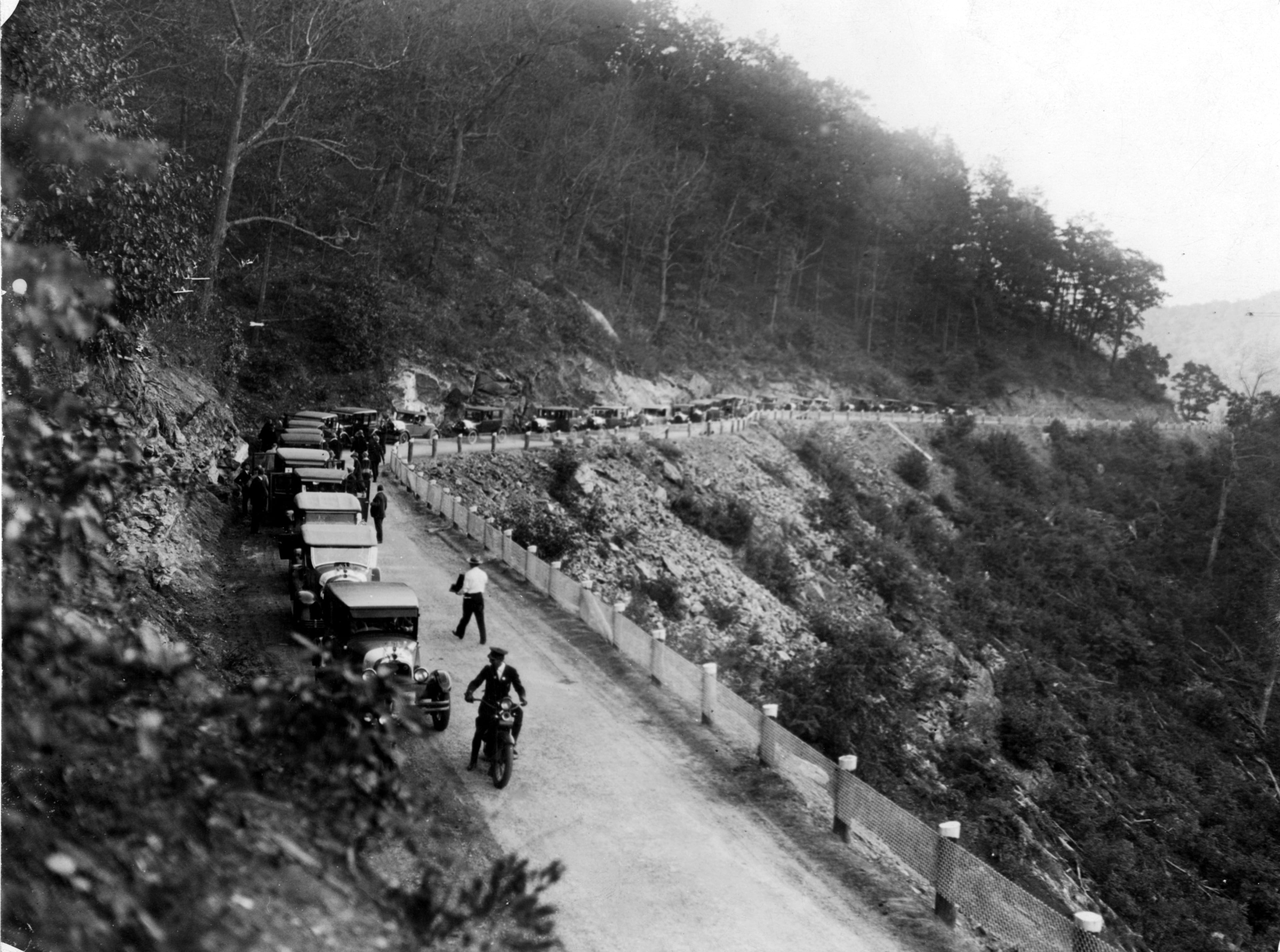 Vehicles line the road at Neels Gap in the north Georgia mountains, probably shortly after the opening of the road in 1925. AJC PHOTO ARCHIVES