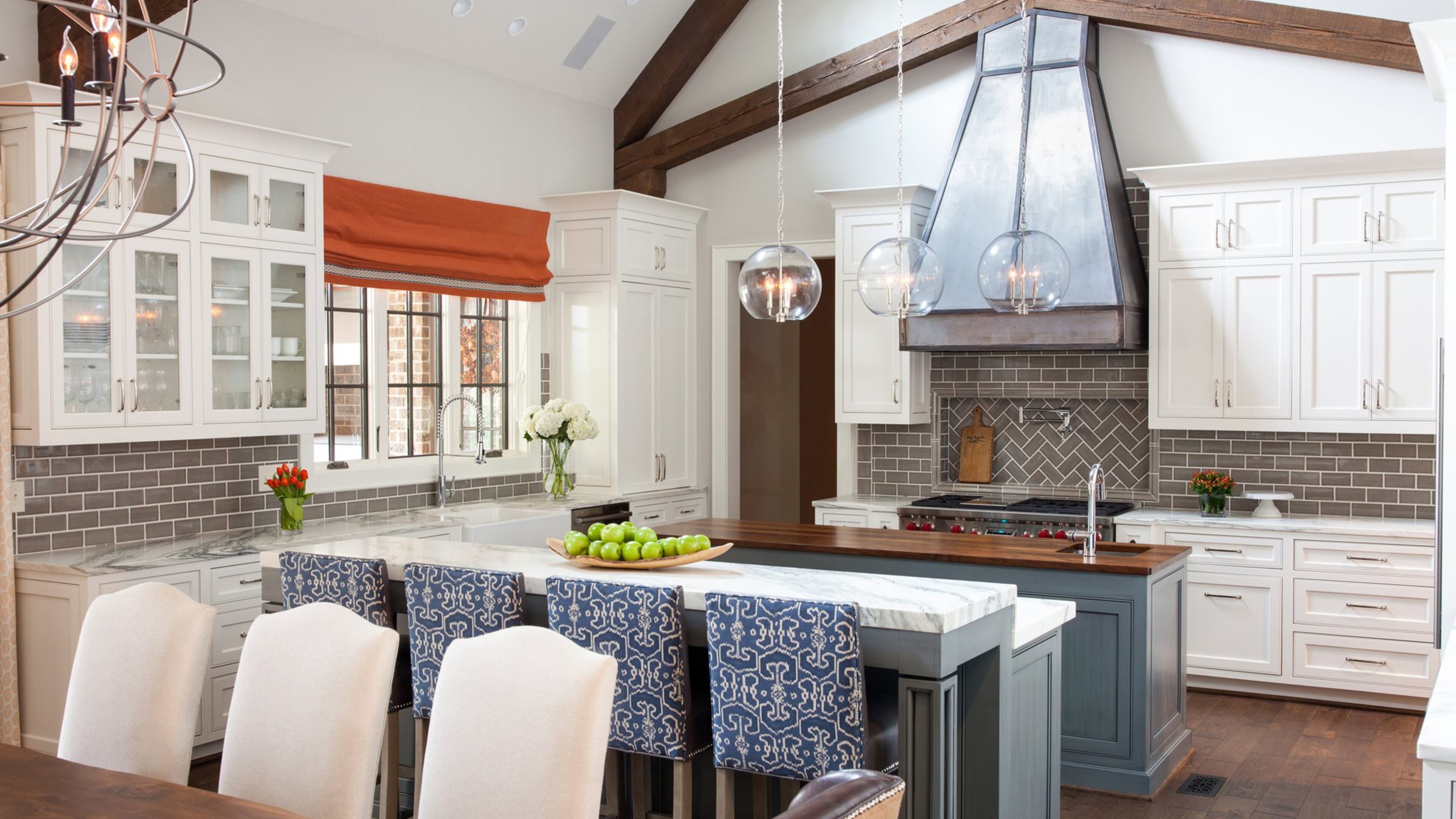 Holcombe assisted with the ground-up design, decorating and styling of this Peachtree Corners home, including the open kitchen. Contributed by Greintime Productions