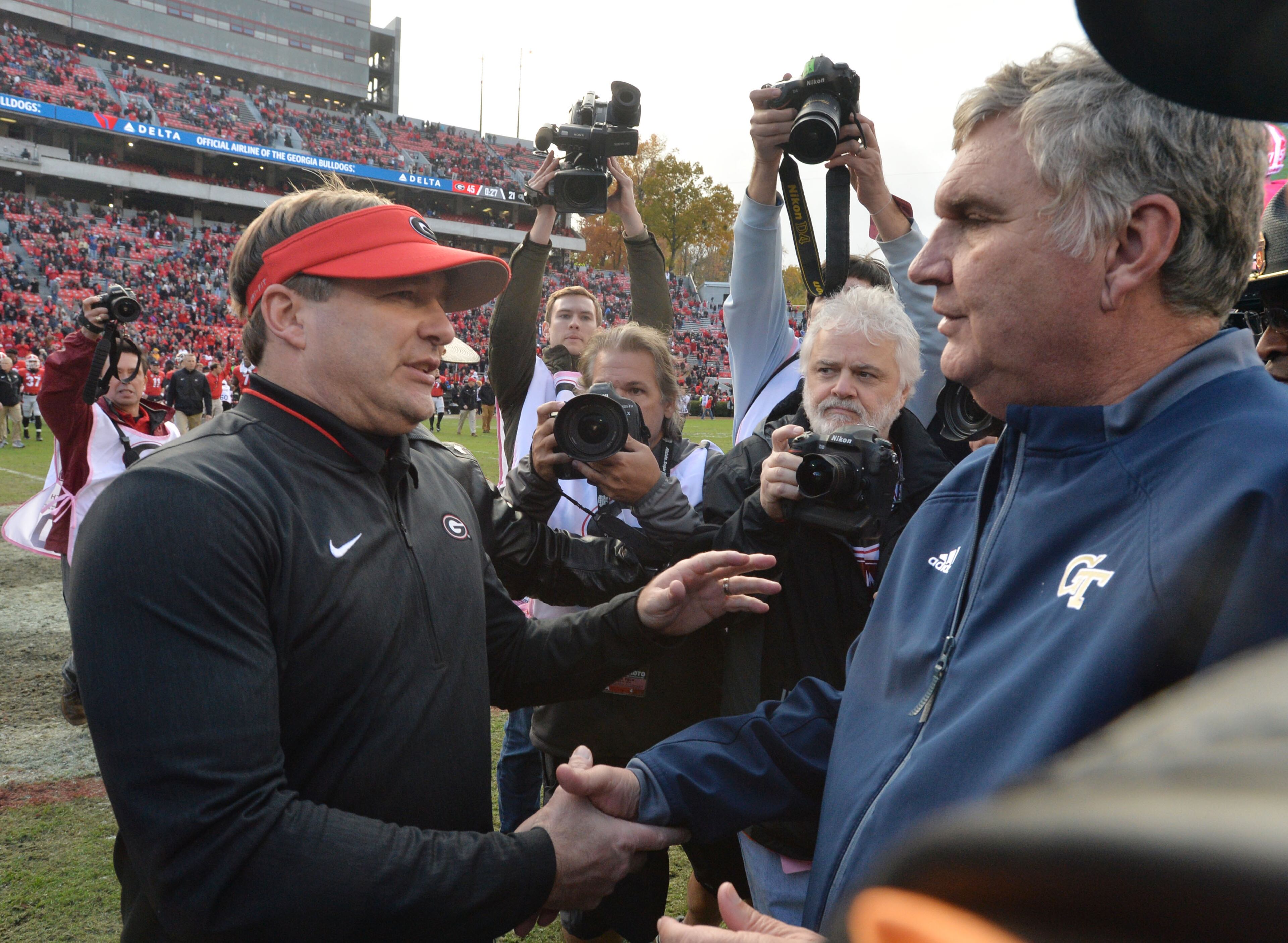 November 24, 2018 Athens - Georgia head coach Kirby Smart and Georgia Tech head coach Paul Johnson shake hands after Georgia defeated the Georgia Tech in a NCAA college football game at Sanford Stadium on Saturday, November 24, 2018. Georgia won 45 - 21 over the Georgia Tech. HYOSUB SHIN / HSHIN@AJC.COM