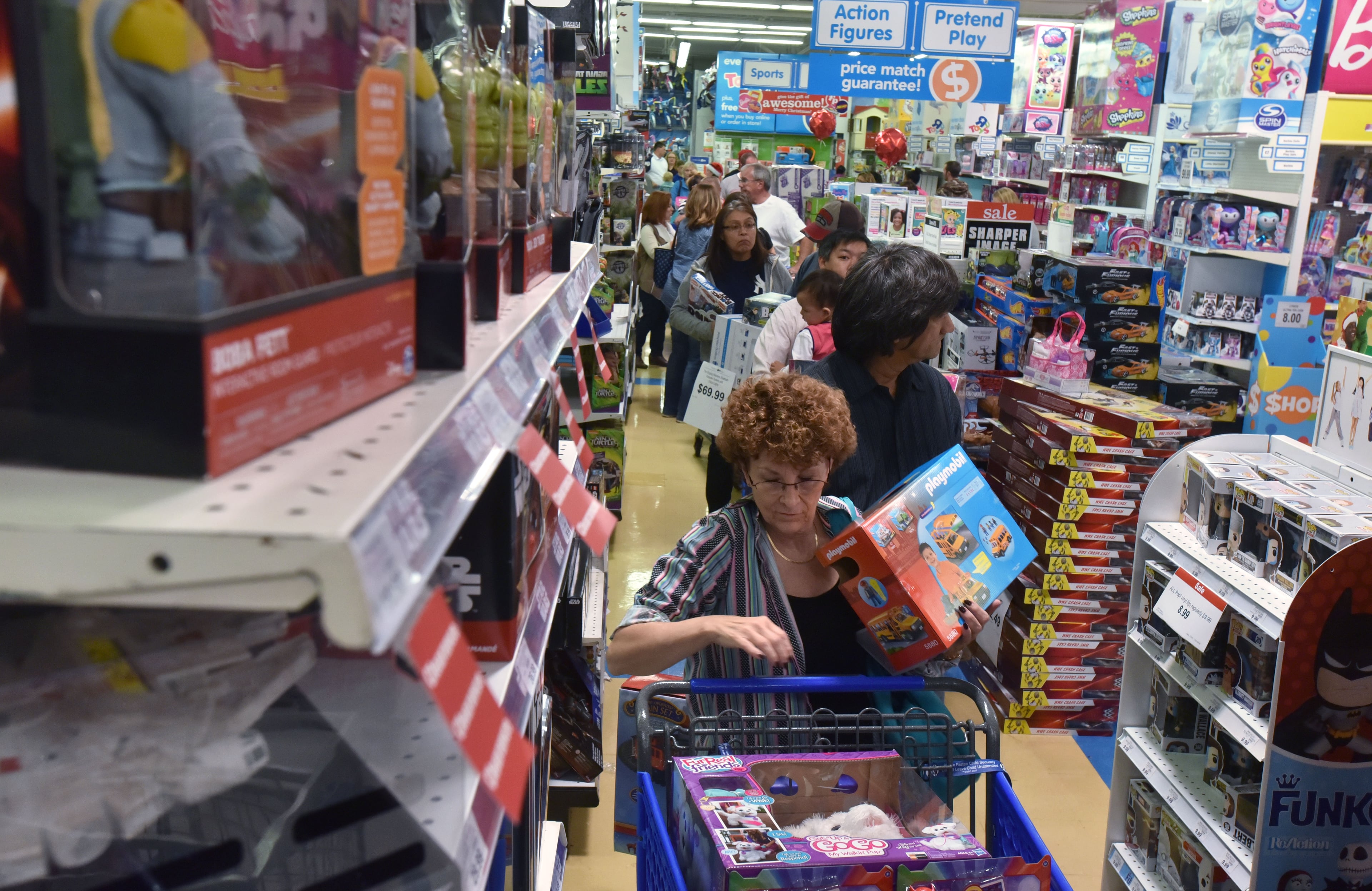The checkout area at the Kennesaw Toys R Us was a busy place during the early Black Friday (or Gray Thursday) sale.