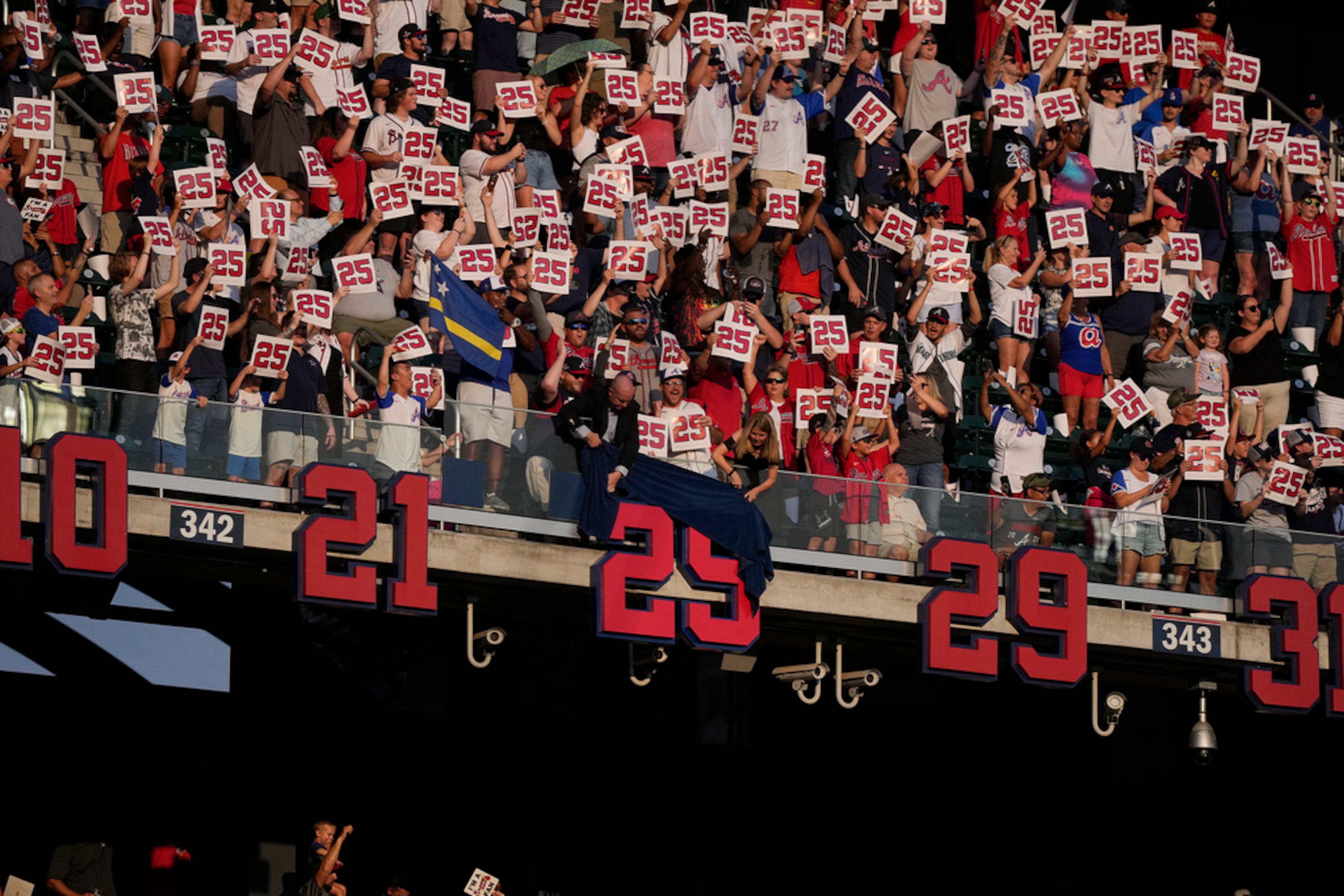 Former Atlanta Braves player, Andruw Jones' number is uncovered as he is honored, Saturday, Sept. 9, 2023, in Atlanta. (AP Photo/Brynn Anderson)