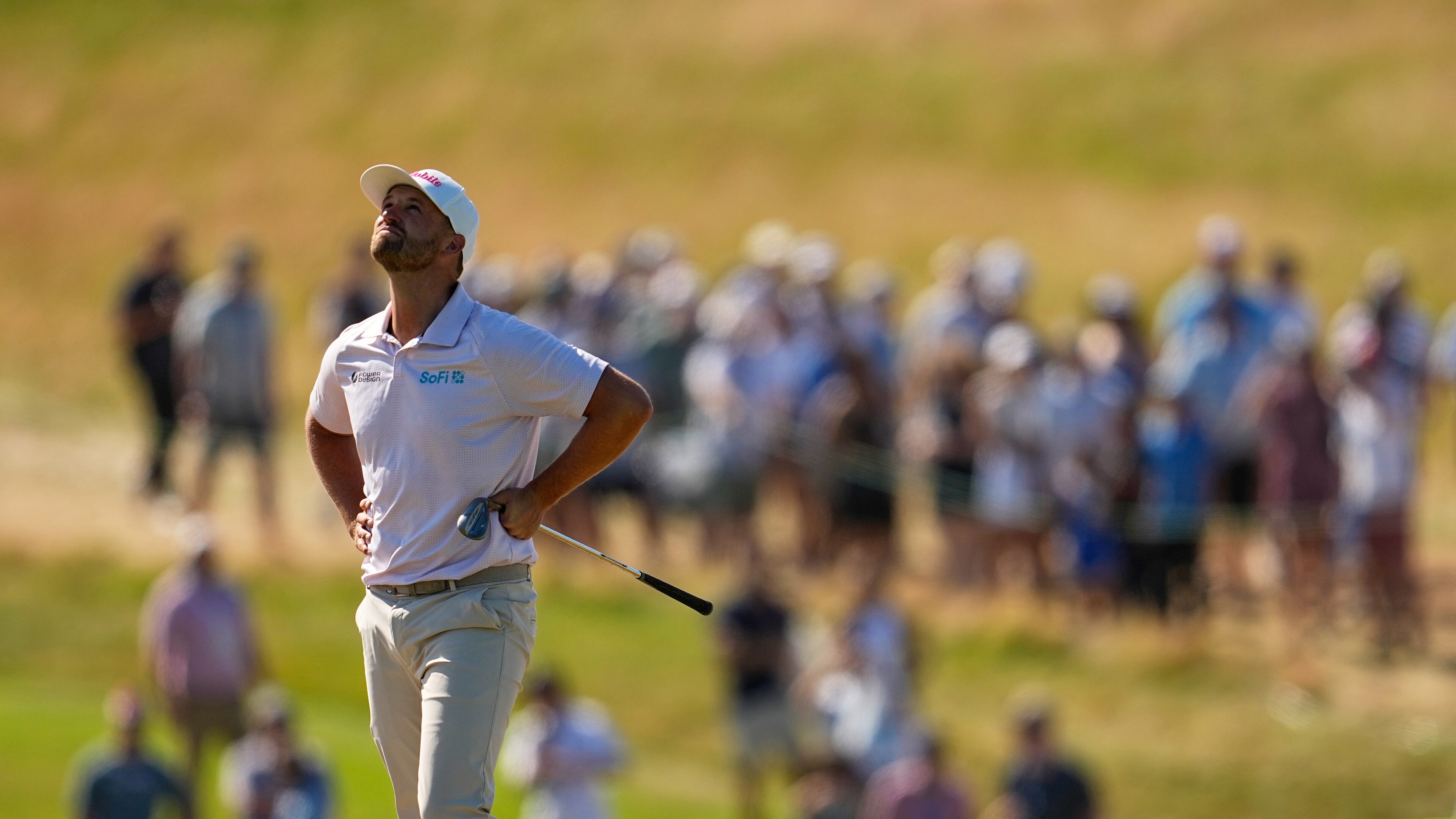 Wyndham Clark reacts to his shot on the ninth hole during the final round of the U.S. Open golf tournament at Shinnecock Hills Golf Club in Southampton, N.Y., Sunday, June 21, 2026. (AP Photo/George Walker IV)