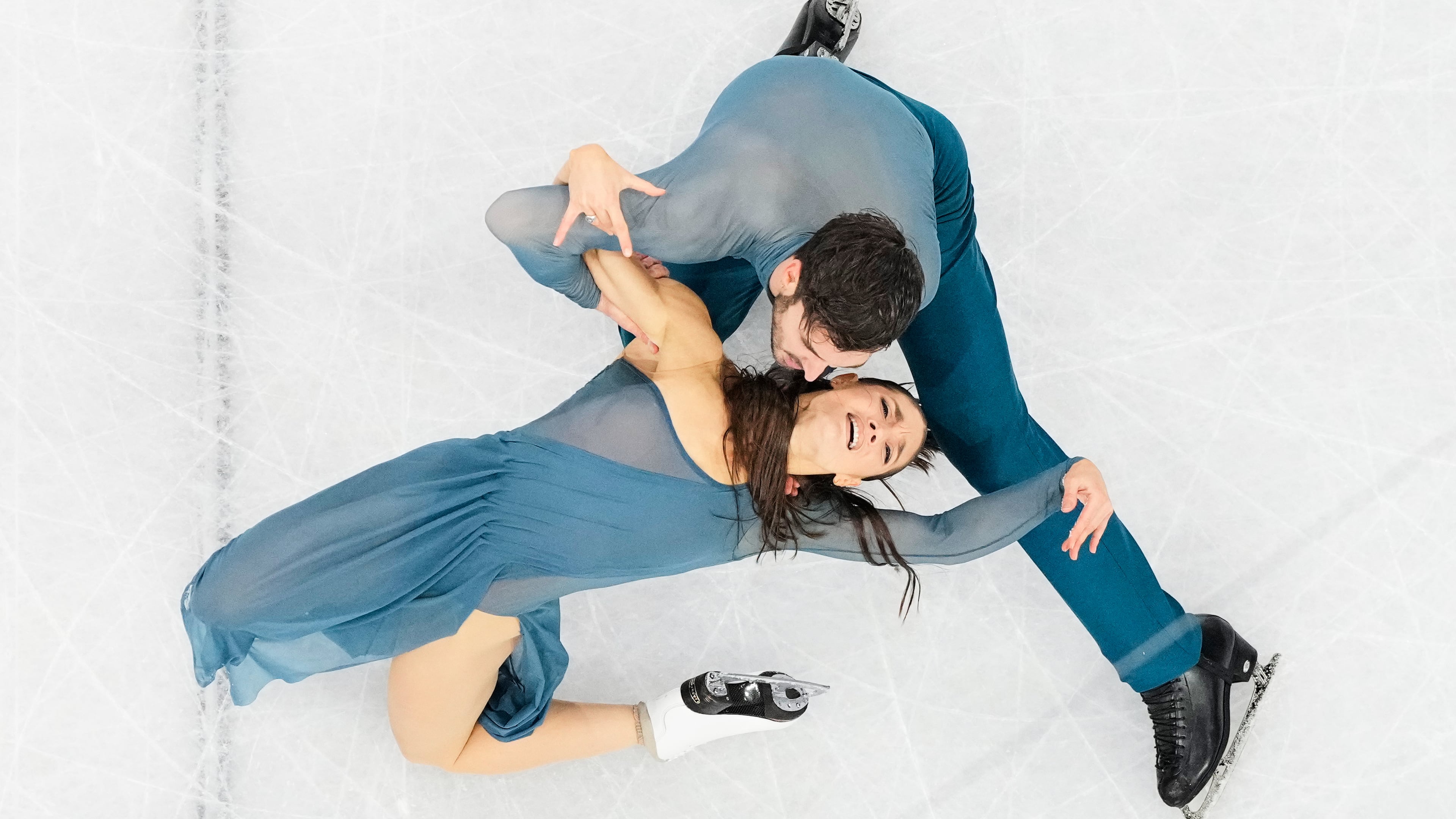 Laurence Fournier Beaudry and Guillaume Cizeron of France compete during the ice dancing free skate in figure skating at the 2026 Winter Olympics, in Milan, Italy, Wednesday, Feb. 11, 2026. (AP Photo/Bernat Armangue)