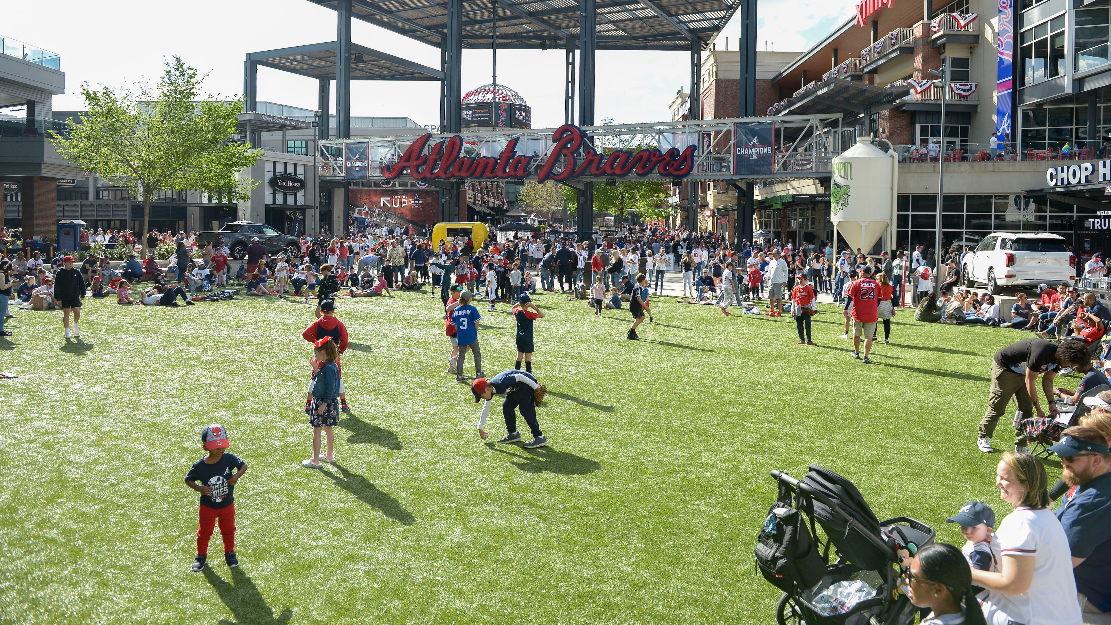 Fans are seen attending opening day festivities Thursday, March 7, 2022 at The Battery. (Daniel Varnado/For the Atlanta Journal-Constitution)
