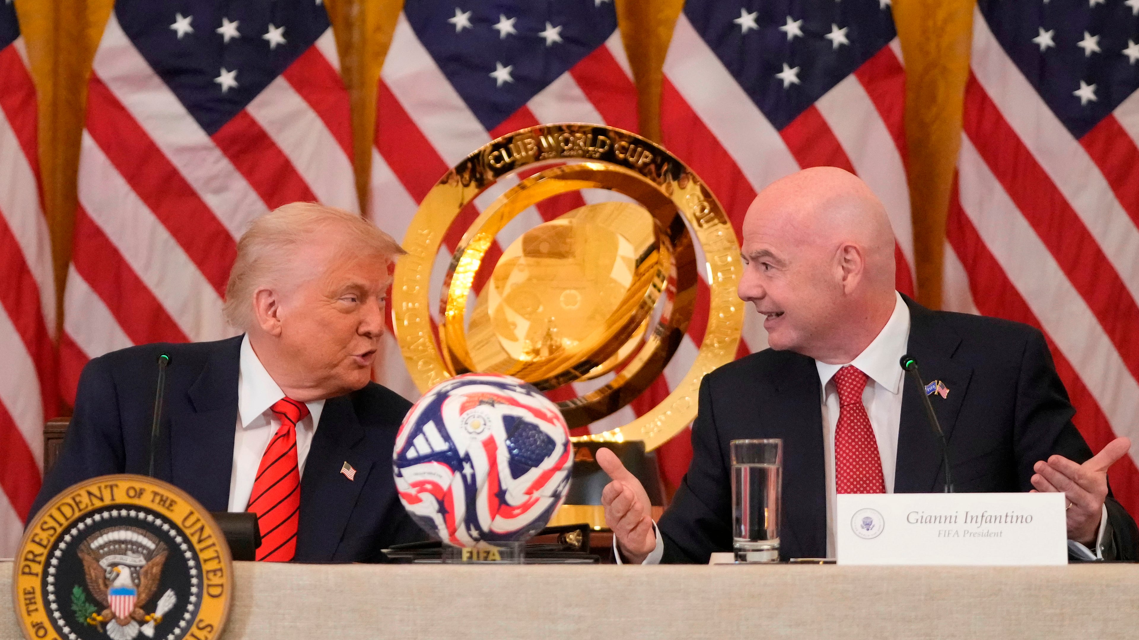 FILE - President Donald Trump and FIFA President Gianni Infantino talk during a FIFA task force meeting in the East Room of the White House, May 6, 2025, in Washington. (AP Photo/Mark Schiefelbein, File)
