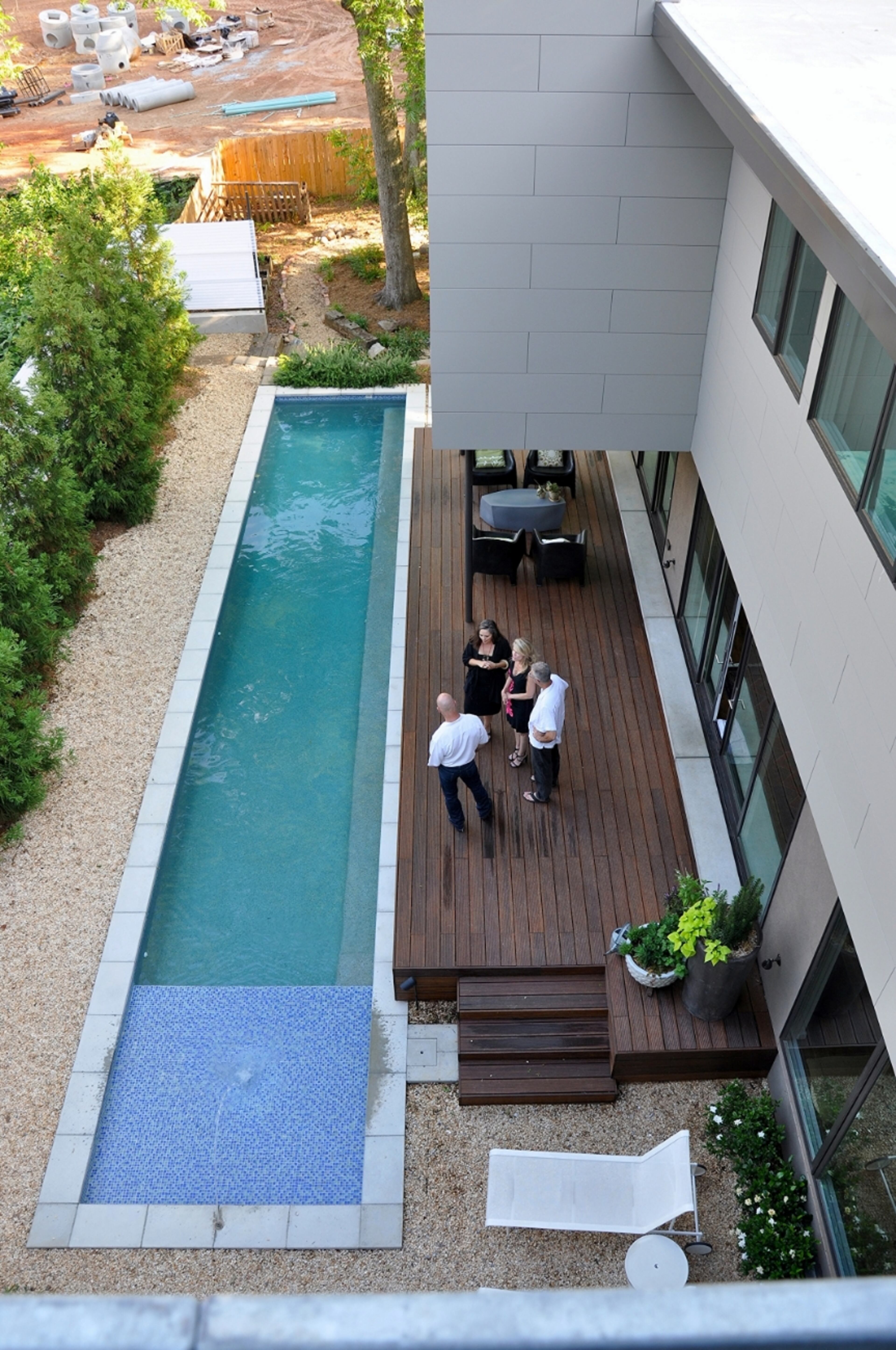 The living level is focused on the exterior pool/koi courtyard and opens onto the deck based on the Japanese engawa.