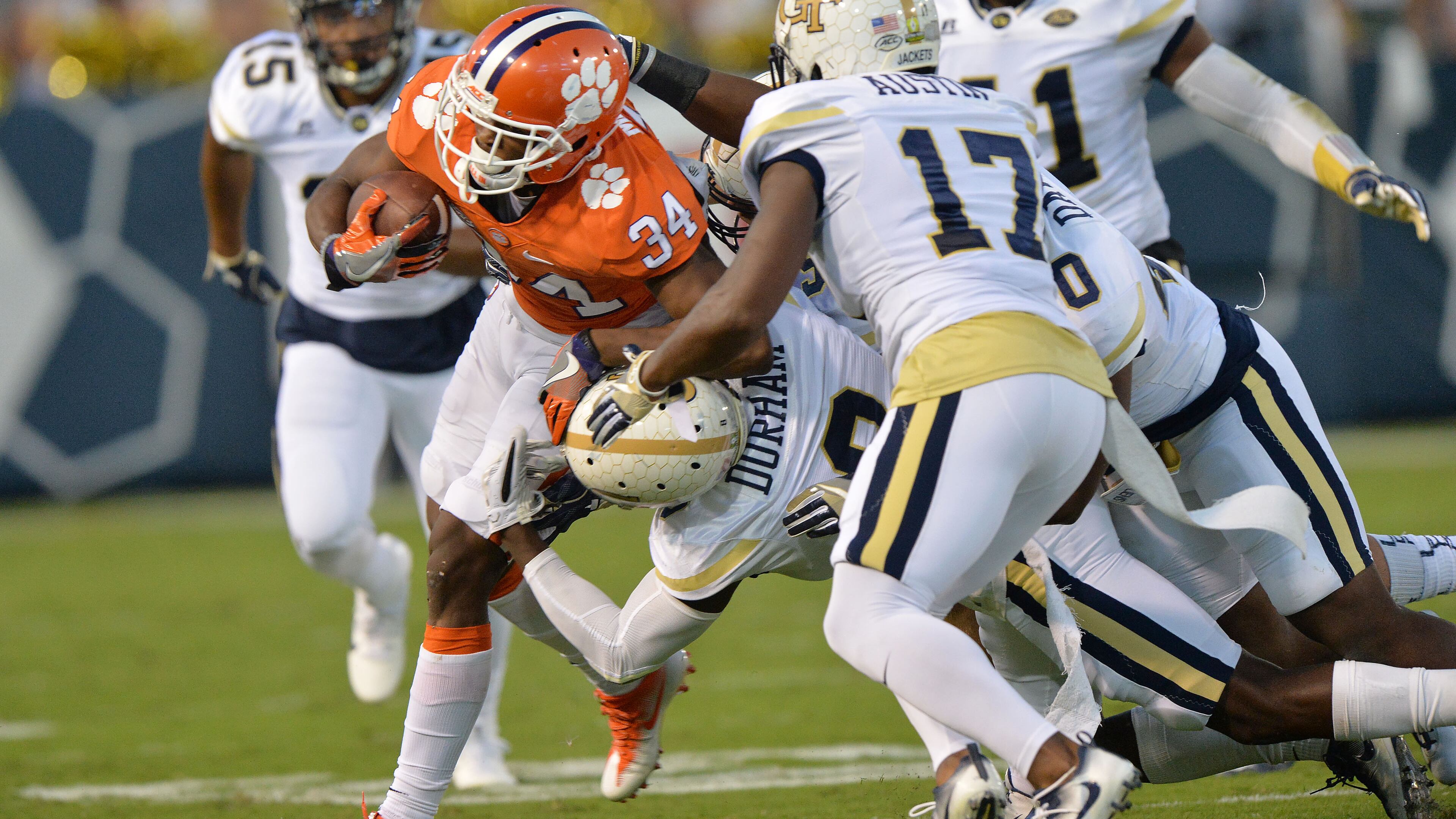 Clemson wide receiver Ray-Ray McCloud (34) gets tackled by Georgia Tech defensive back Step Durham (8) at Bobby Dodd Stadium on Thursday, September 22, 2016. Lance Austin (17) moves in ready to help. HYOSUB SHIN / HSHIN@AJC.COM