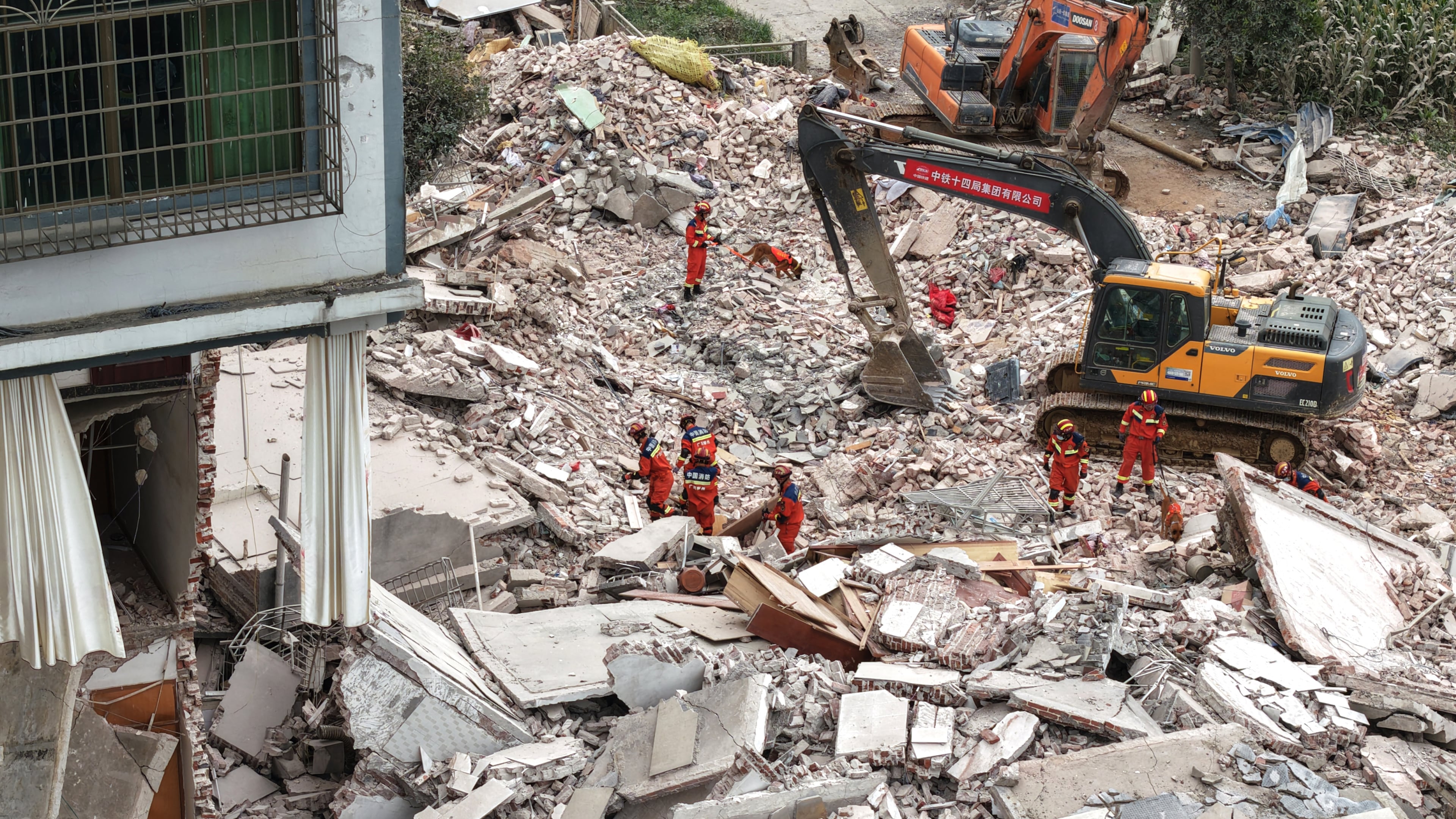In this photo released by Xinhua News Agency, Rescuers conduct search and rescue at a collapsed building following a 5.2 magnitude earthquake hit in Liuzhou, in south China's Guangxi Zhuang Autonomous Region on Monday, May 18, 2026. (Li Hanchi/Xinhua via AP)