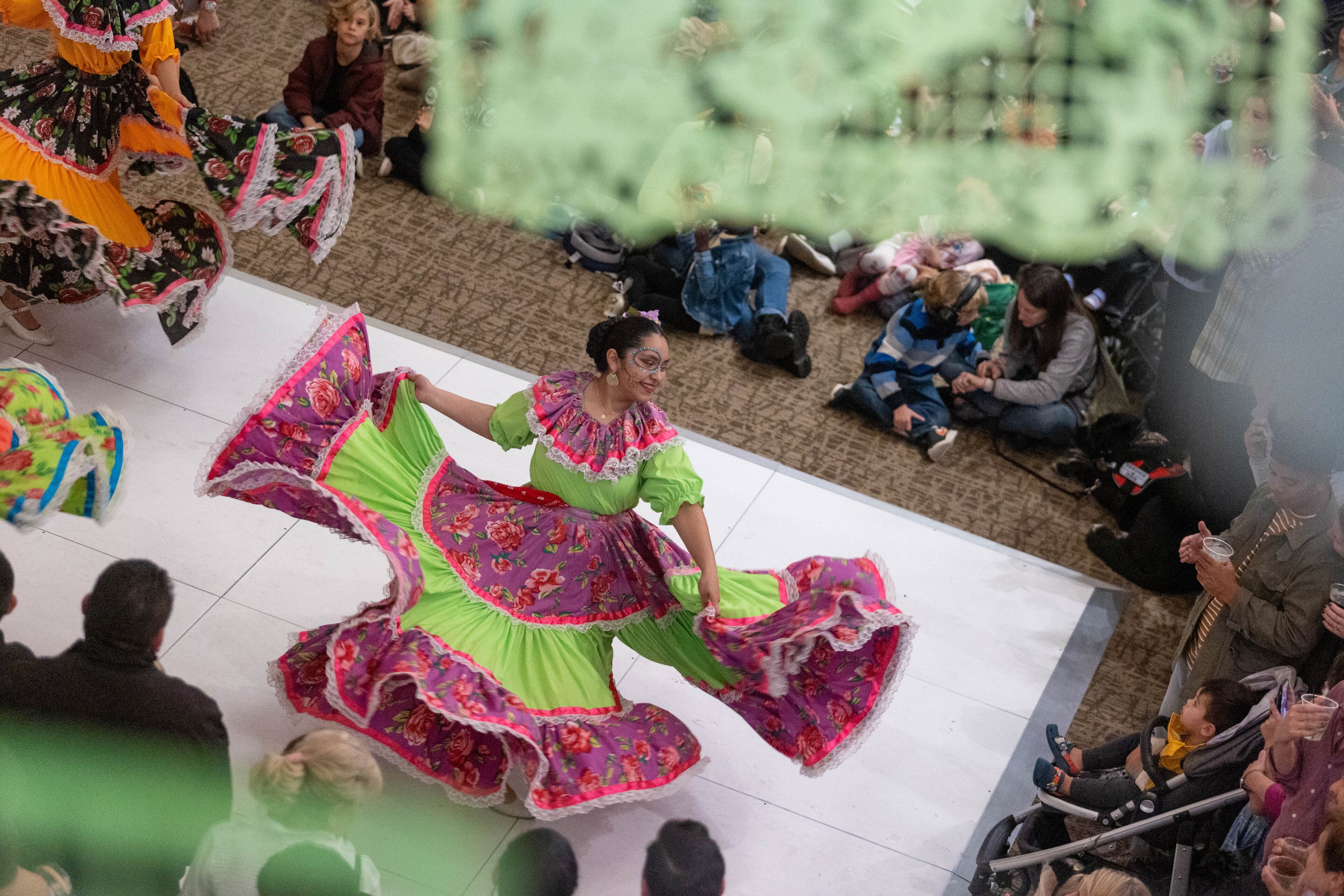 A girl performs a dance at the Dia de Los Muertos Festival hosted by the Atlanta Symphony Orchestra at the Woodruff Arts Center on Sunday, October 30, 2022. (Photo: Jenn Finch for The Atlanta Journal-Constitution)
