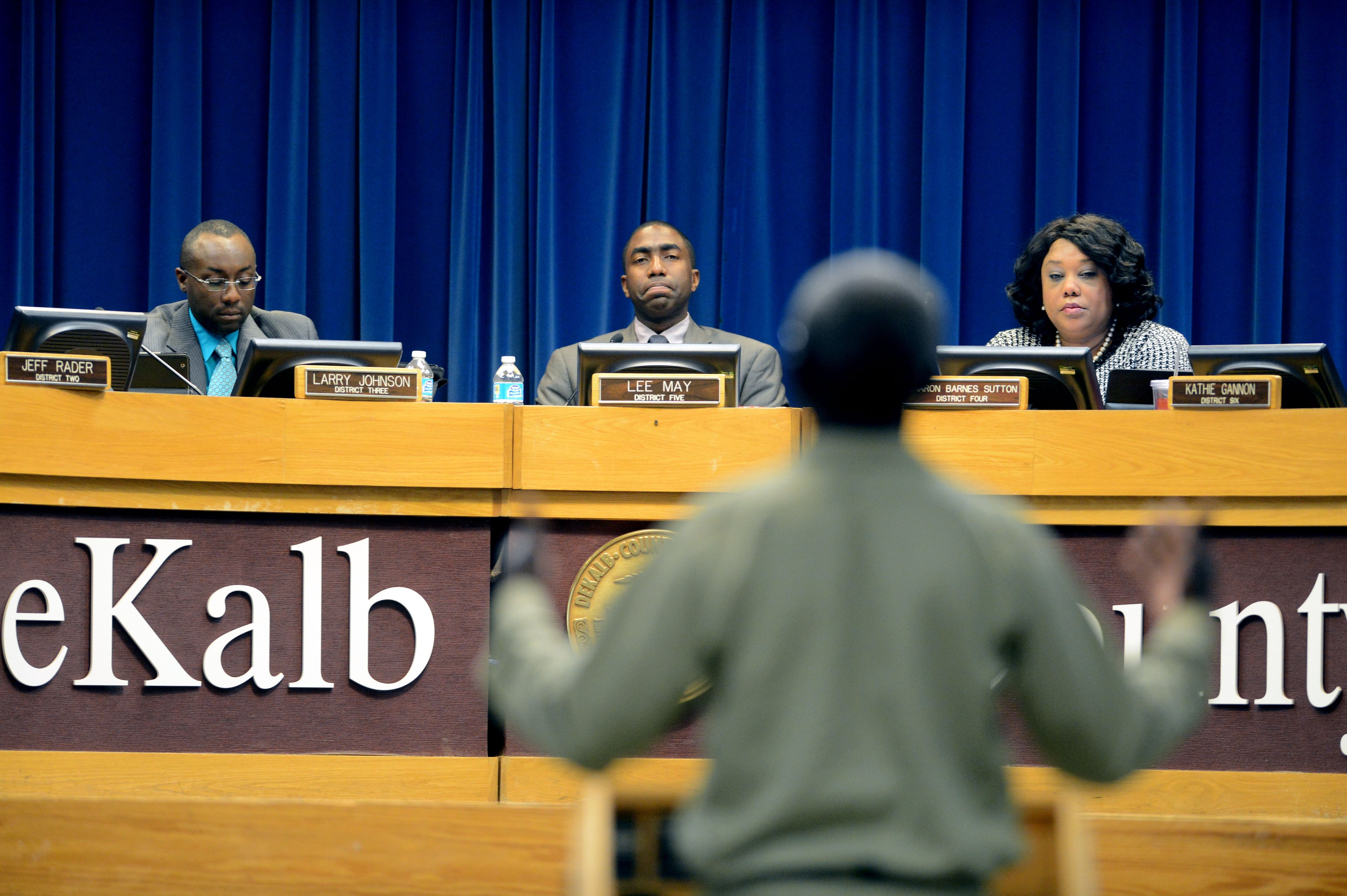 April 23, 2013: DeKalb County Commissioners Larry Johnson (left), Lee May and Sharon Barnes Sutton listen as R.B. Williams presents his case. DeKalb County employees in the Wastewater Management and Sanitation departments brought their cases for a raise rather than a bonus before the DeKalb County Commission.