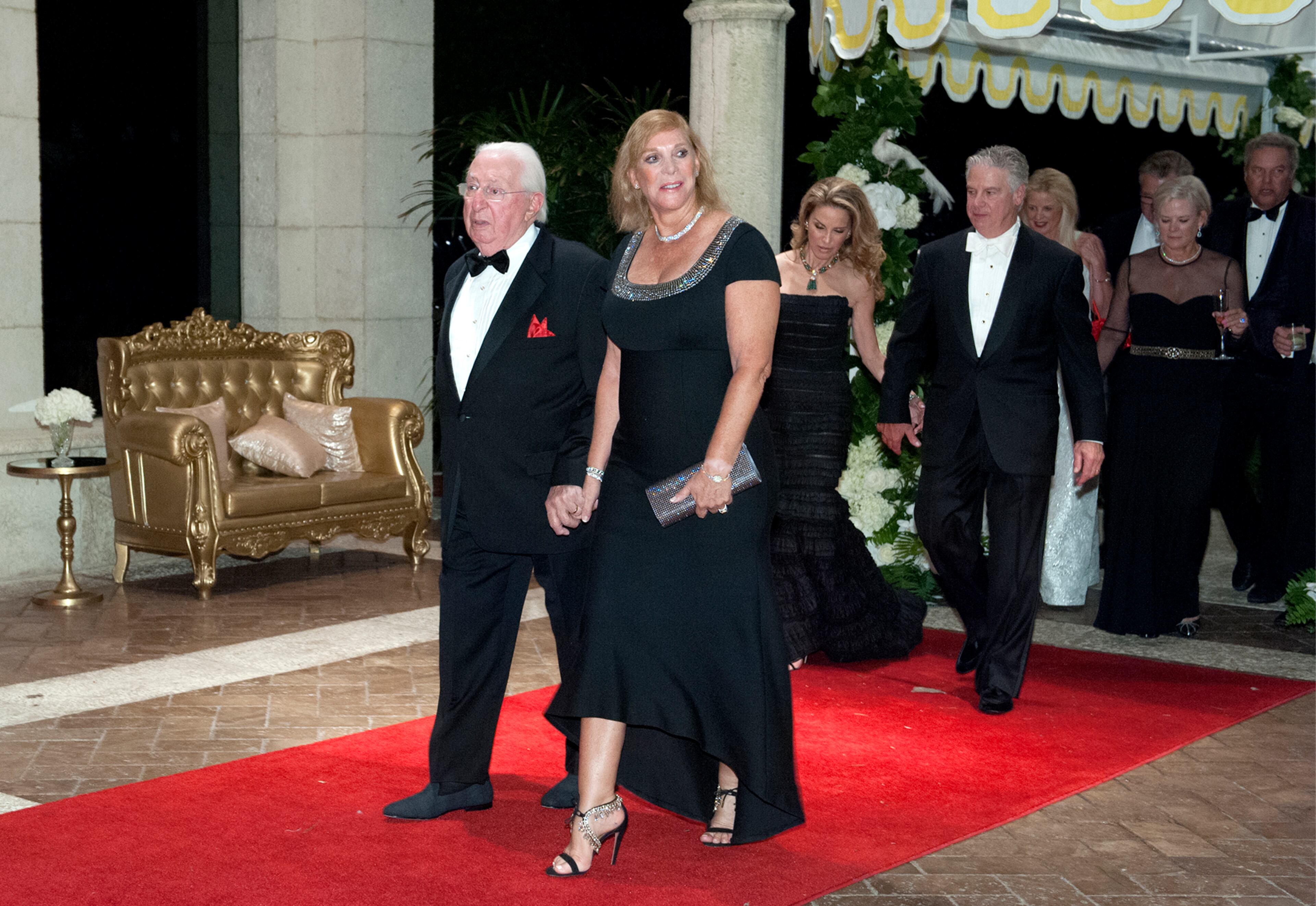 Irvin and Robin Saltzman arrive at the Diamond Centennial Red Cross Ball at Mar-a-Lago Club Saturday.