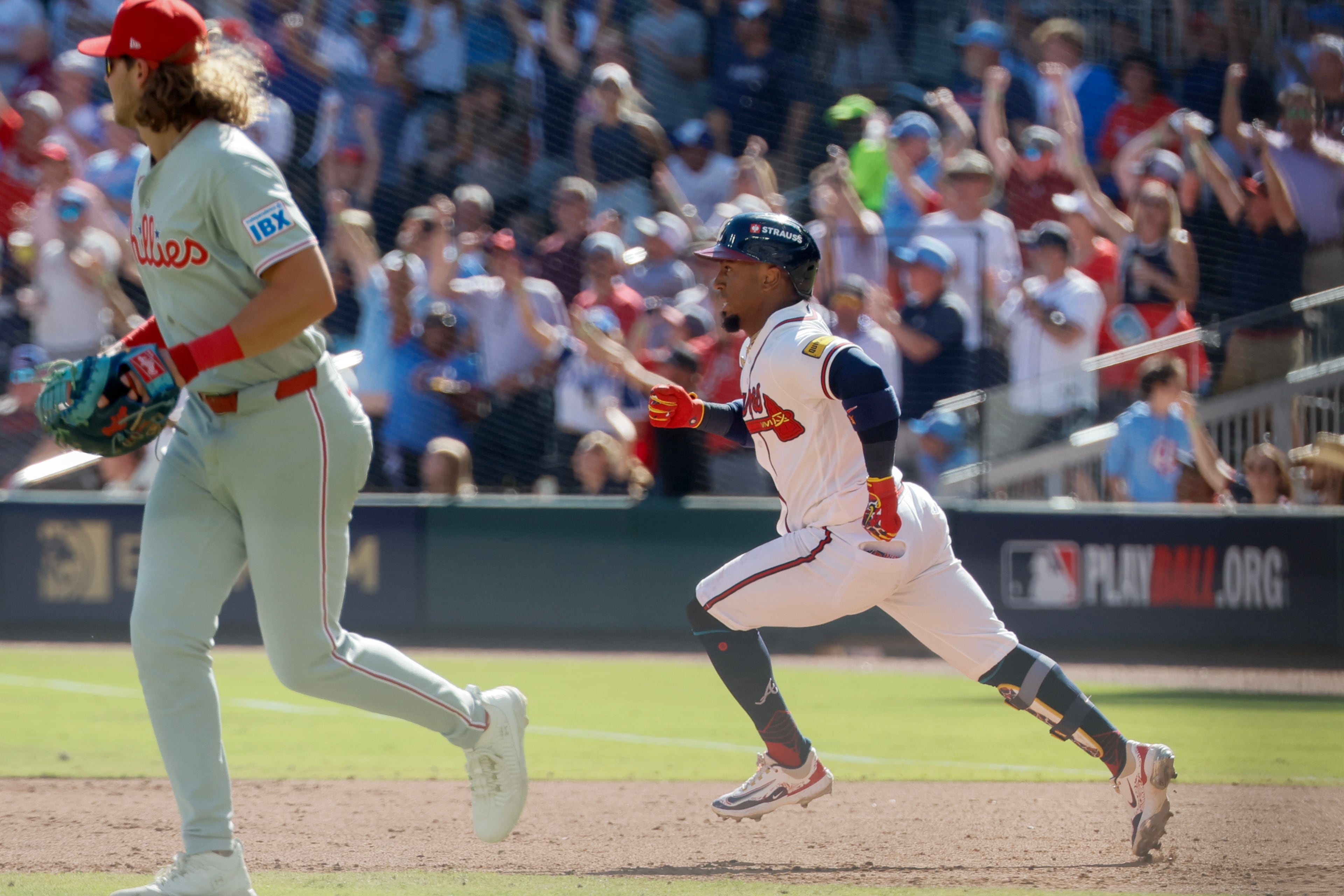 Atlanta Braves' Ozzie Albies rounds the bases after hitting an RBI triple against the Philadelphia Phillies during the sixth inning of Game 1 of a MLB National League Wild Card playoff series between the Atlanta Braves and the Philadelphia Phillies, Tuesday, Sept. 29, 2026, in Atlanta. (Miguel Martinez/AJC)