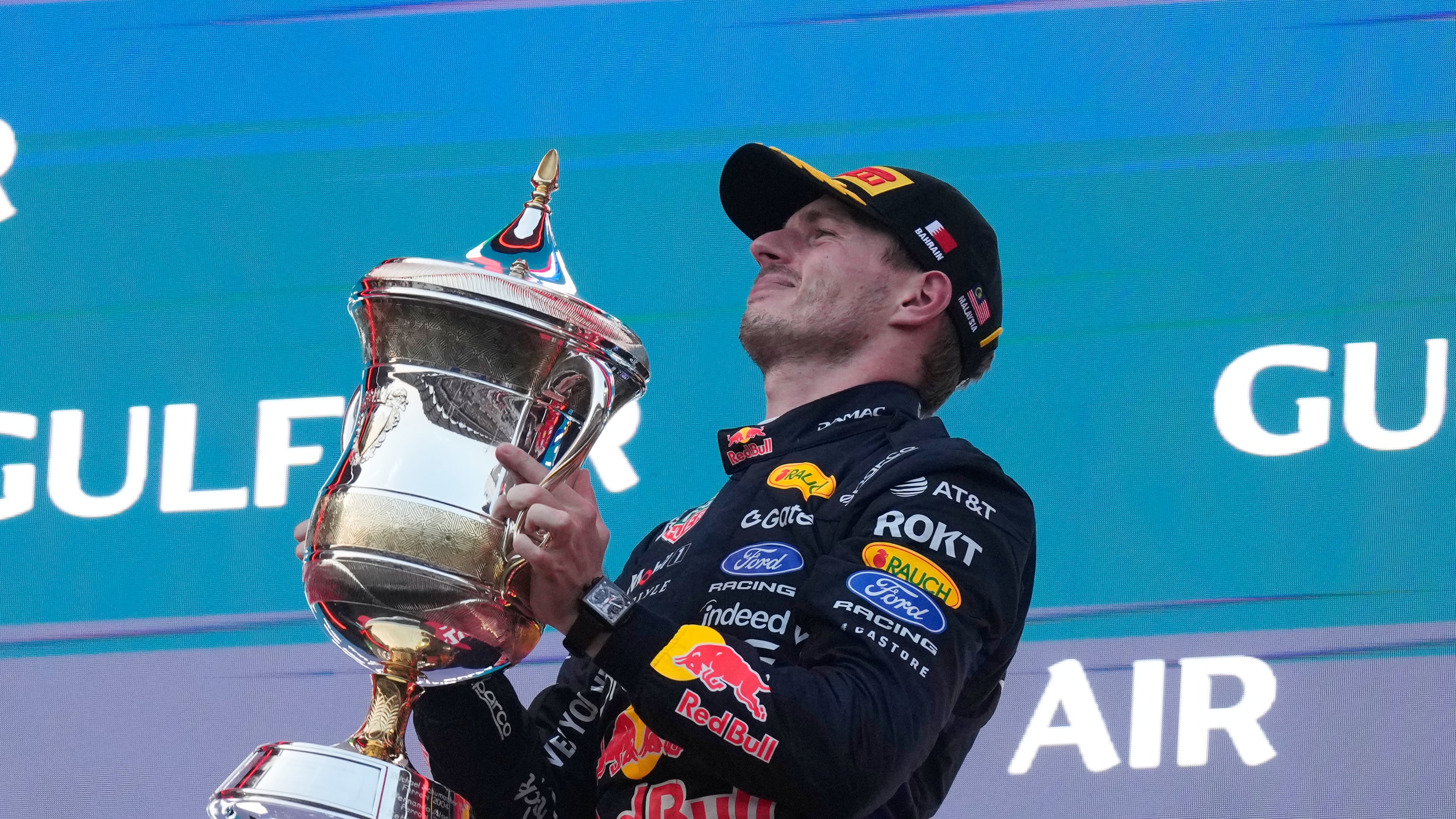 Red Bull driver Max Verstappen of the Netherlands celebrates on the podium after winning the Bahrain Grand Prix in Sepang, Malaysia, Sunday, Oct. 4, 2026. (AP Photo/Aijaz Rahi)