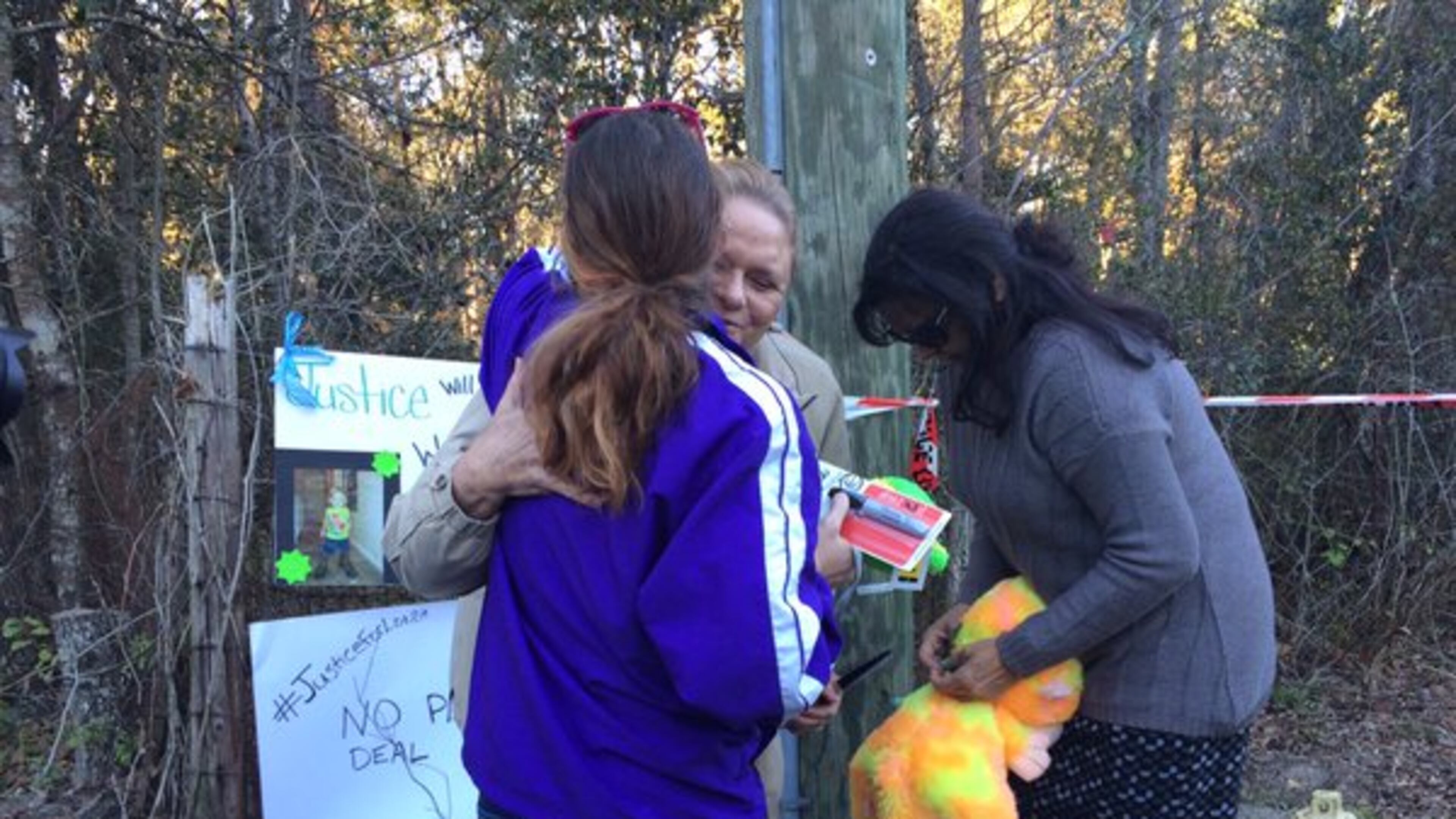 Community members gathered at the search site where Jacksonville Sheriff Mike Williams said crews discovered remains that are likely those of missing toddler Lonzie Barton.