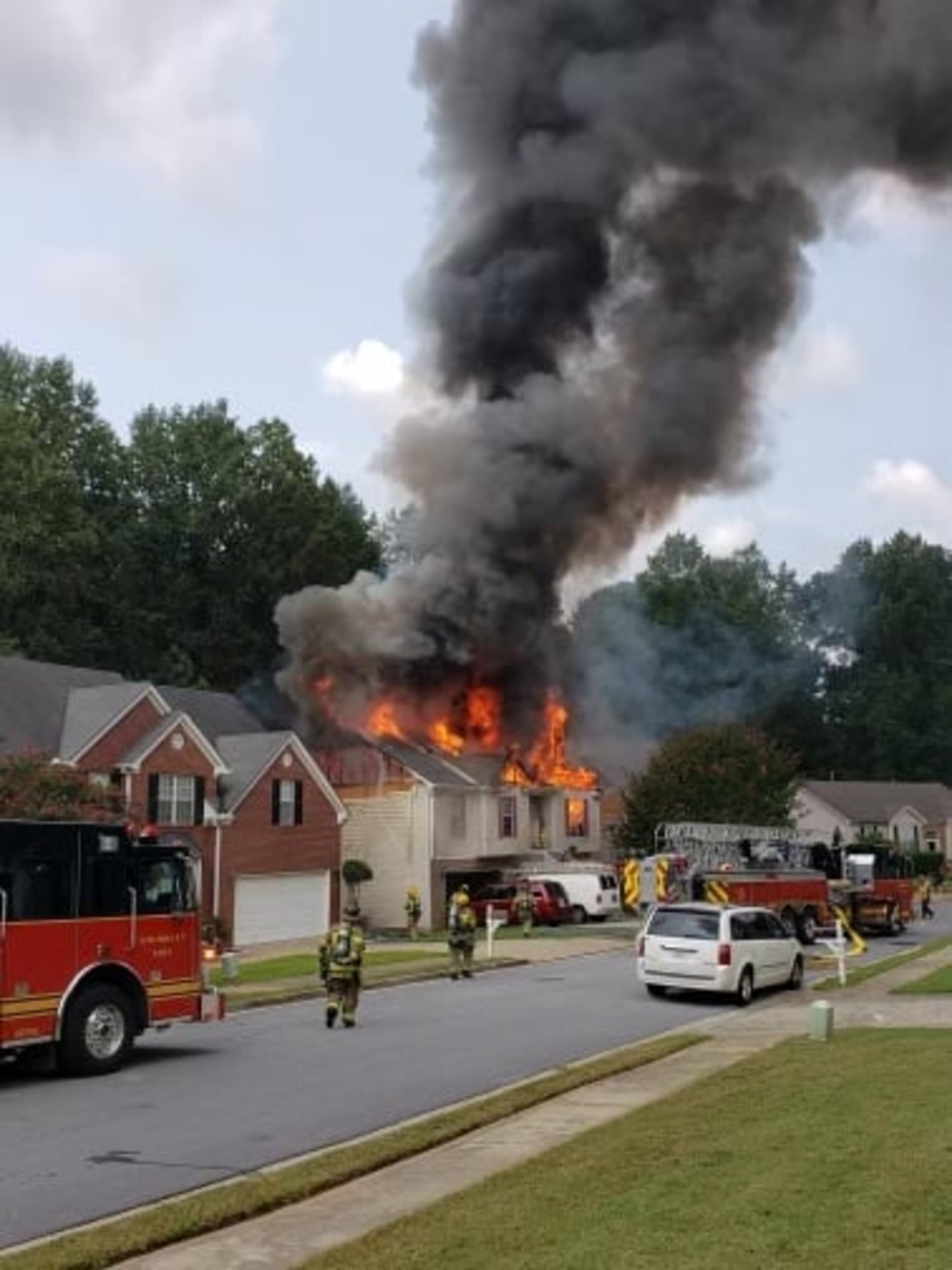 Two neighboring homes were damaged by the fire.