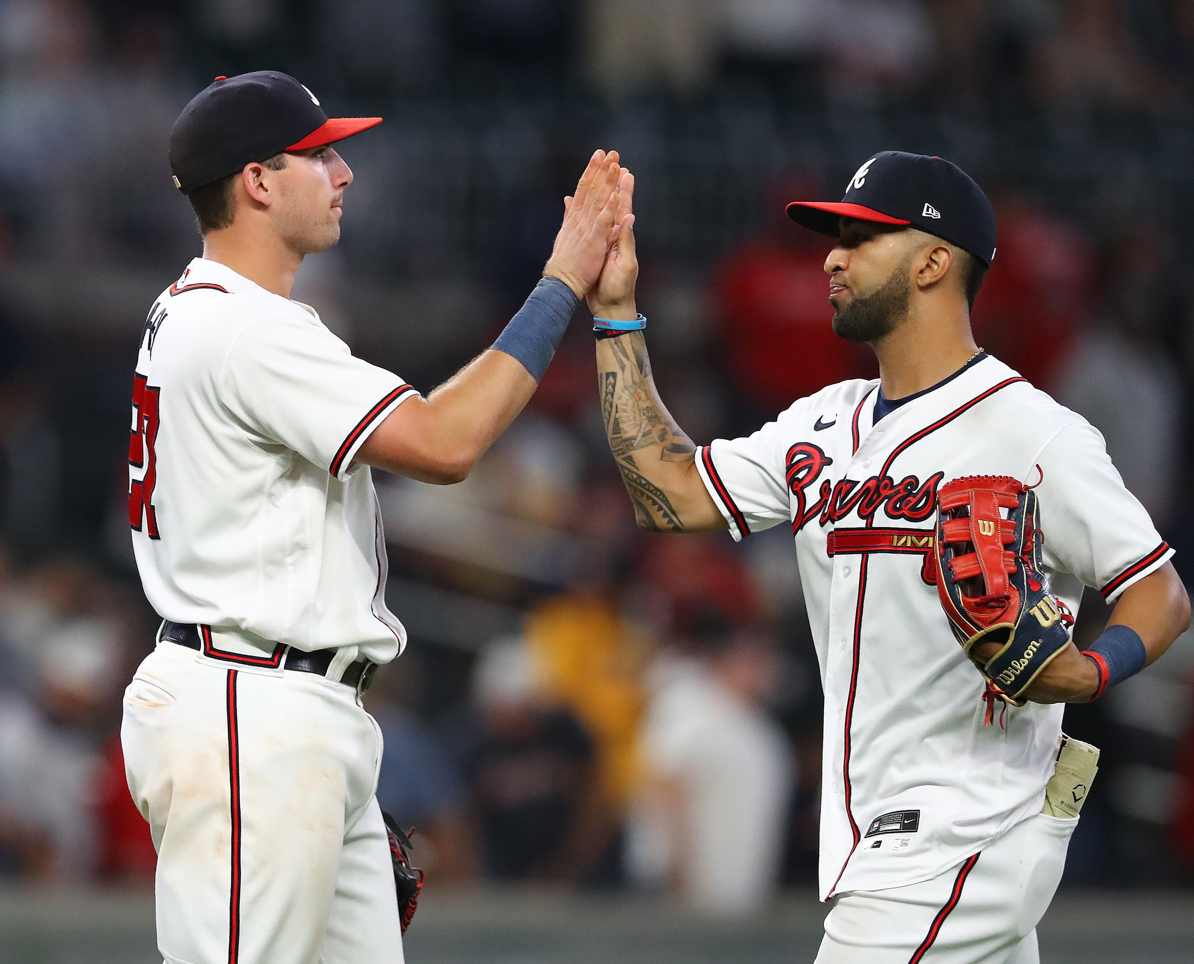 Braves third baseman Austin Riley (left) and outfielder Eddie Rosario, who both homered in the game, celebrate Atlanta's 5-2 victory against the Nationals on Monday night at Truist Park. (Curtis Compton / Curtis Compton@ajc.com)