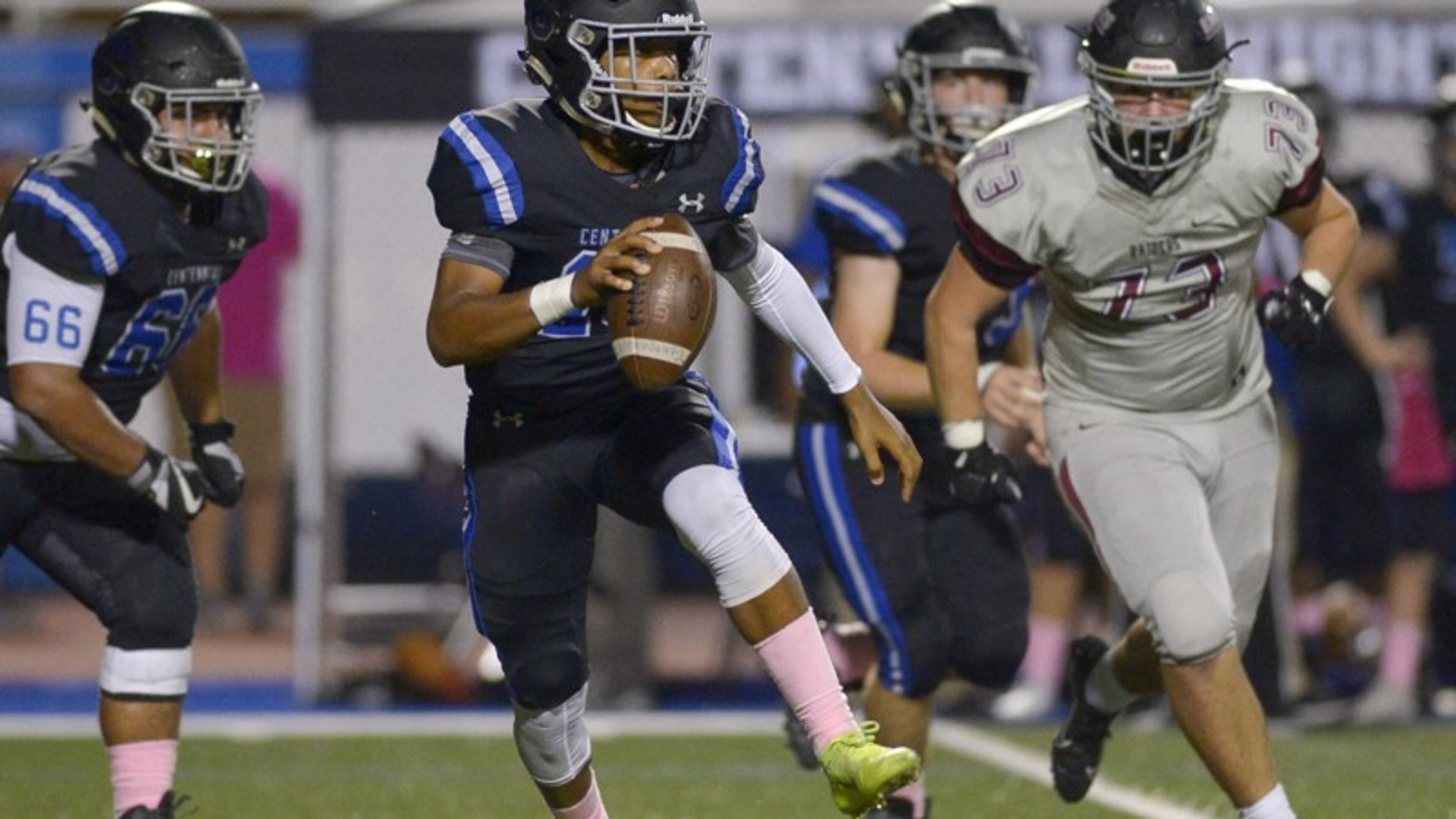 Centennial quarterback Zaire Goff (10) scrambles to avoid Alpharetta's defense in the first half of Friday's game at Centennial. (Daniel Varnado/Special)