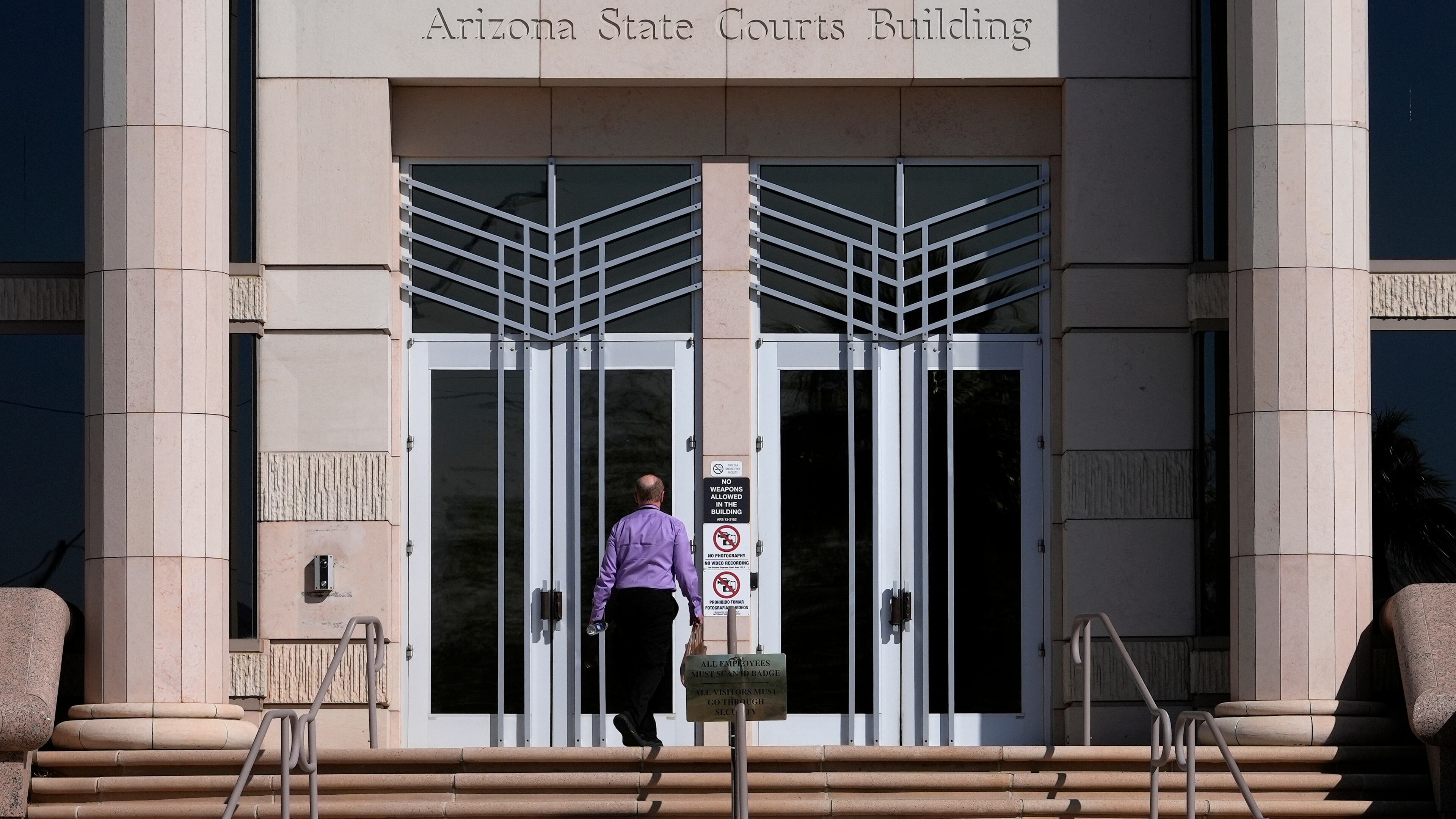 FILE - A man enters the Arizona Supreme Court building on April 10, 2024, in Phoenix. (AP Photo/Matt York, File)
