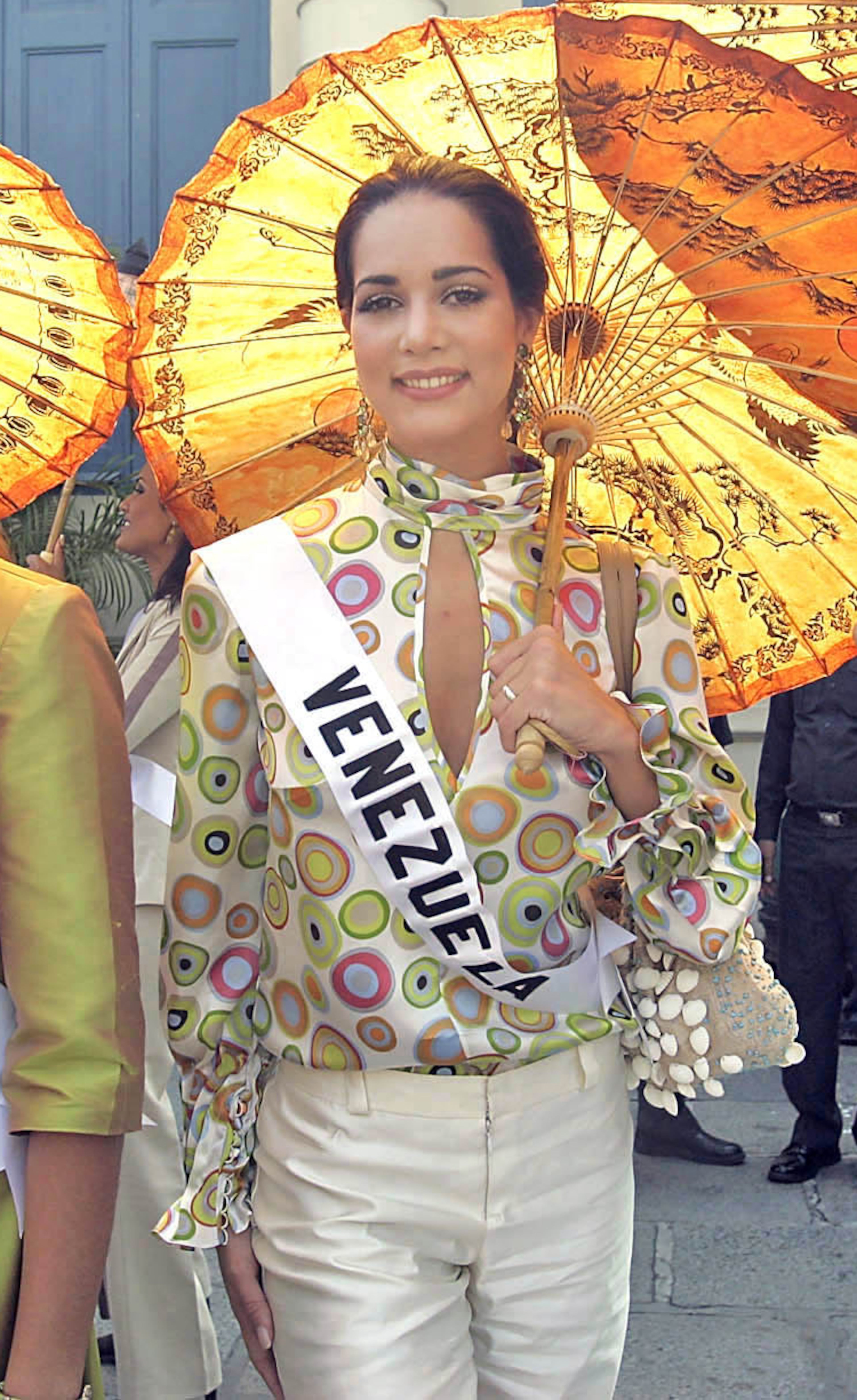 In this May 11, 2005, file photo, Miss Venezuela Monica Spear poses for photographs outside the Grand Palace ahead of the Miss Universe pageant in Bangkok, Thailand. Venezuelan authorities say the soap-opera actress and former Miss Venezuela and her husband were shot and killed resisting a robbery after their car broke down.