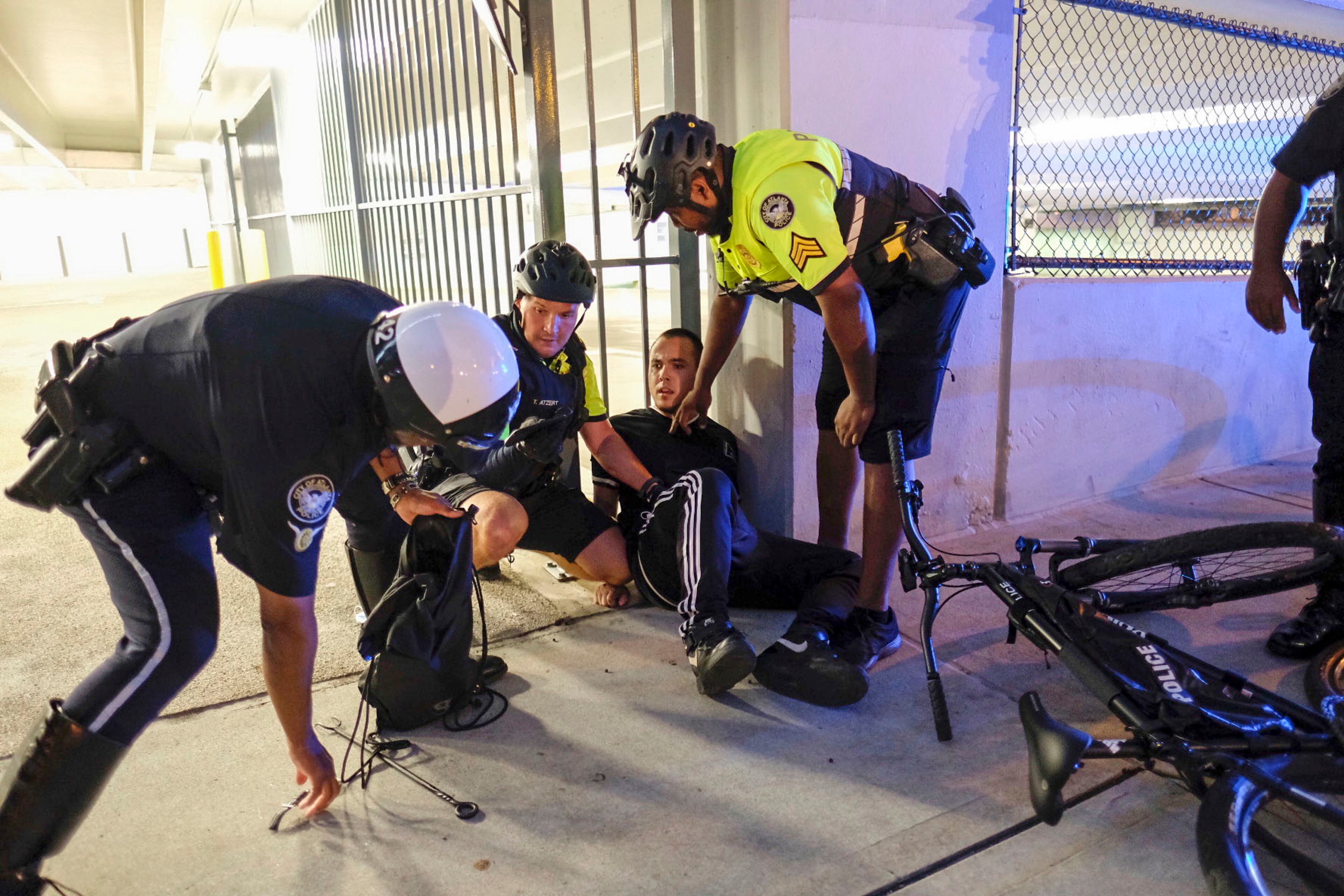 May 30, 2020 - Atlanta - Police arrested this man who was seen with fireworks and other paraphernalia as the city of Atlanta was under a 9pm curfew as protests continued for a second day. Protests over the death of George Floyd in Minneapolis police custody spread around the United States on Saturday, as his case renewed anger about others involving African Americans, police and race relations. Ben Gray for the Atlanta Journal Constitution