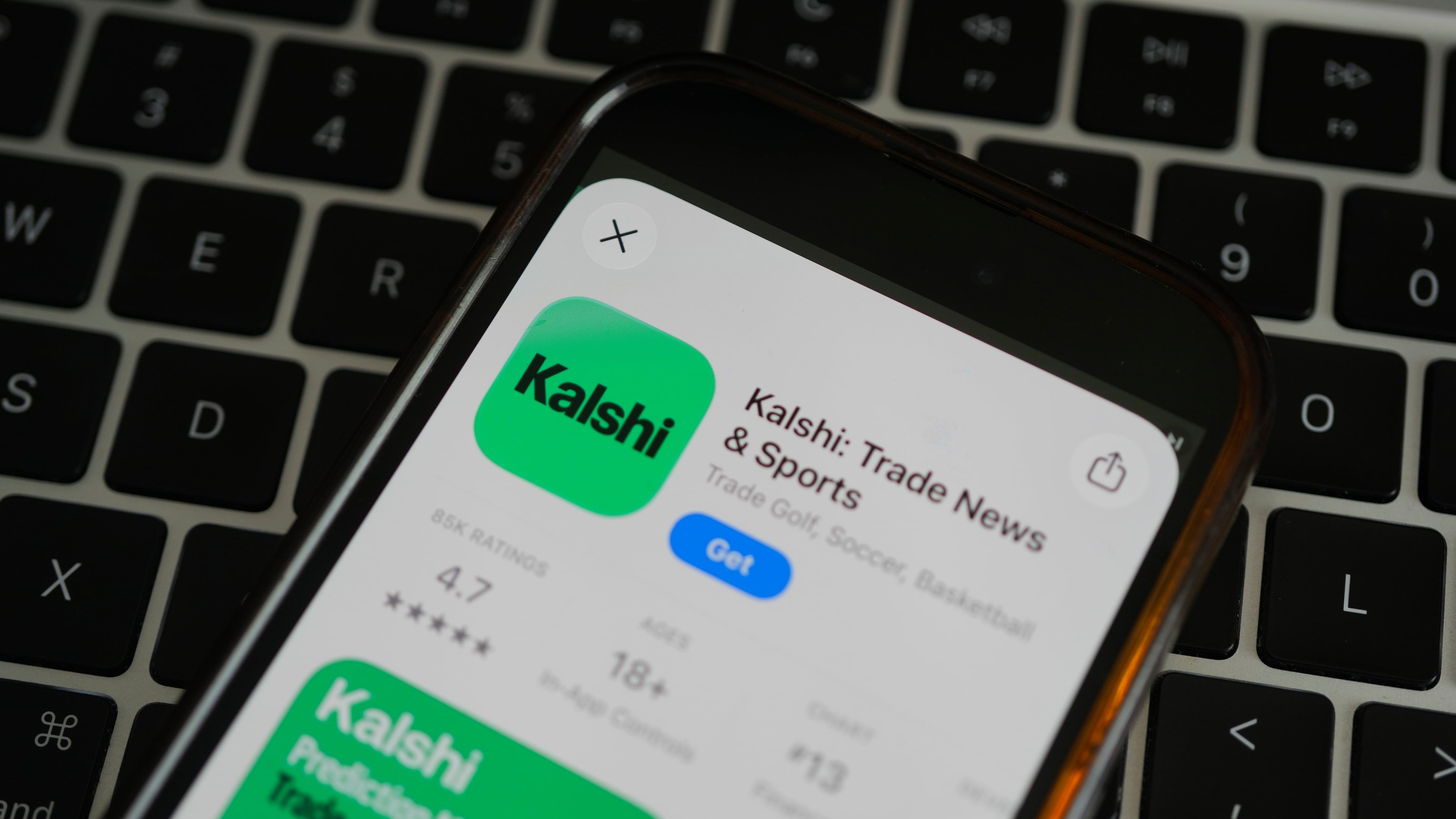 FILE - An ad for the prediction market app Kalshi is displayed on a mobile phone Thursday, April 16, 2026, in Chicago. (AP Photo/Erin Hooley,File)