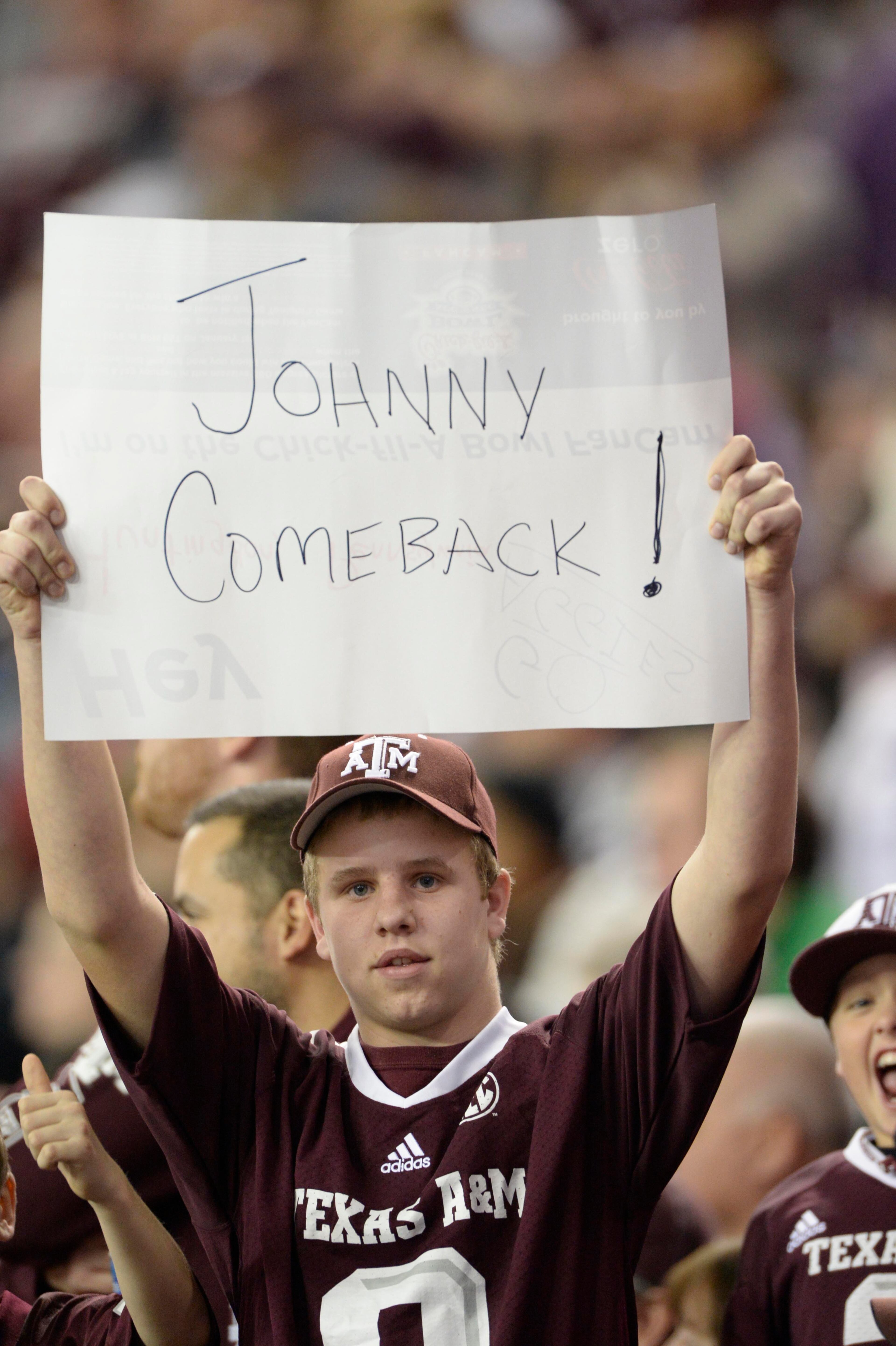 Texas A&M Aggies fan shows a sign in the fourth quarter against the Duke Blue Devils in the 2013 Chick-fil-a Bowl at the Georgia Dome.