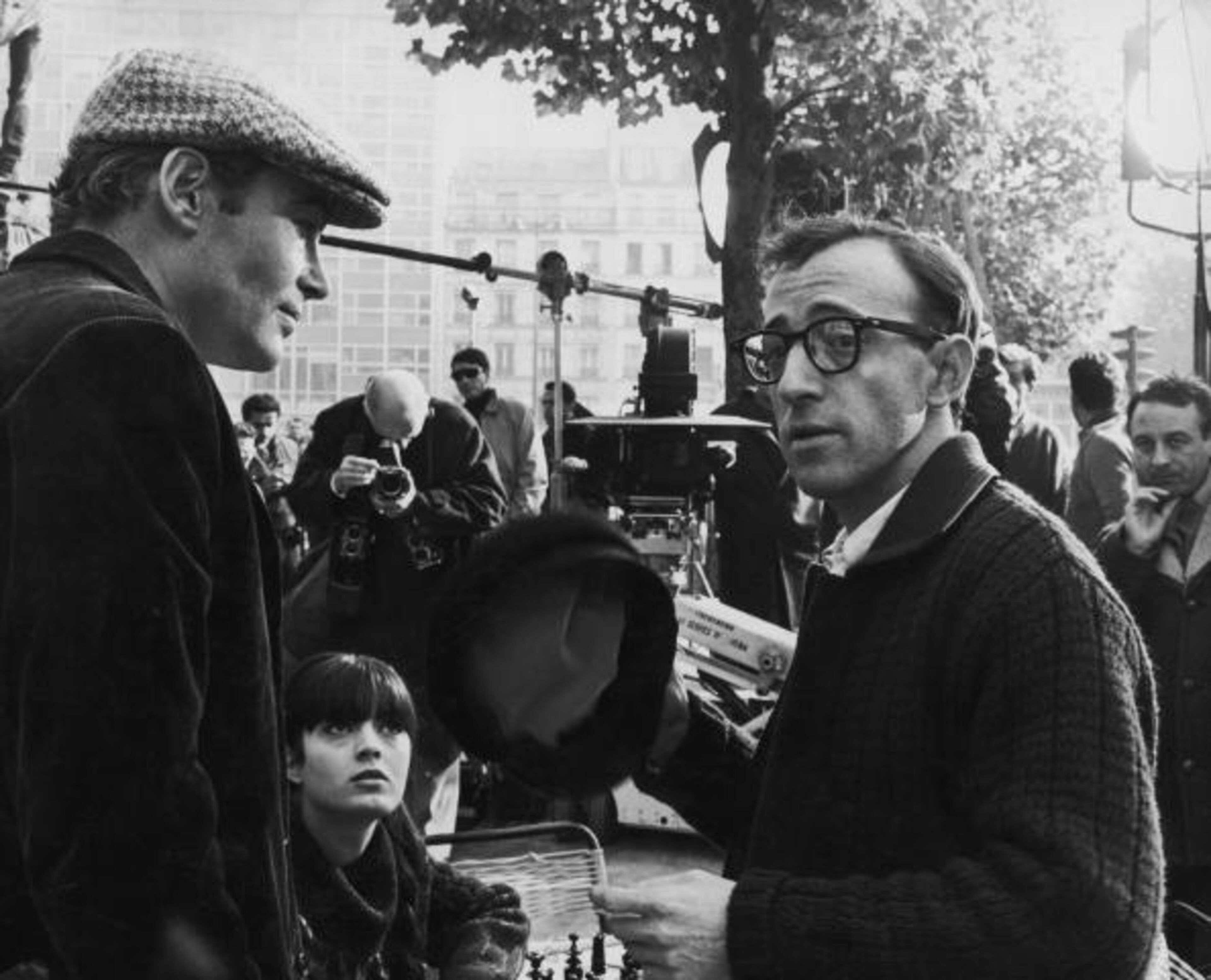 Irish actor Peter O'Toole, French actress Nicole Karen, American actor, writer and comedian Woody Allen and English director Clive Donner in Montparnasse, Paris during filming of 'What's New, Pussycat', 1965. (Photo by AFP/Getty Images)