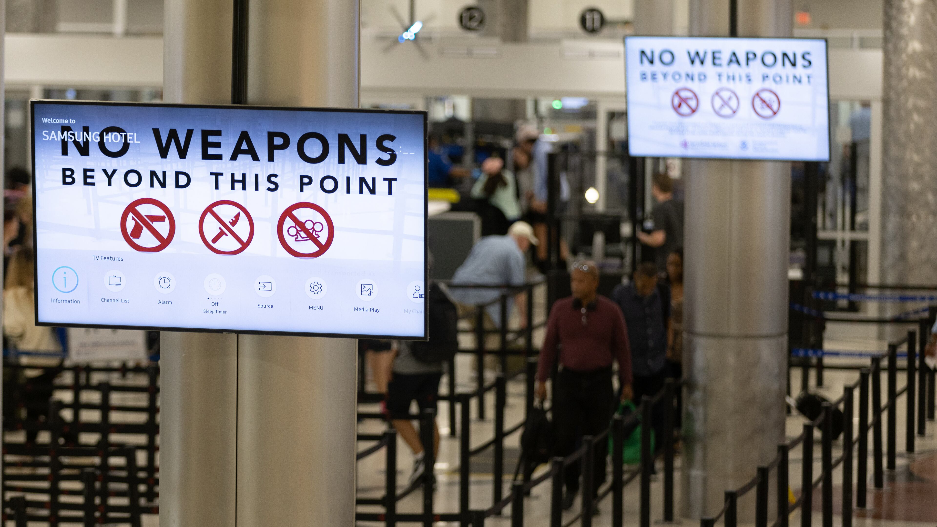 Passengers head through the security checkpoint at Hartsfield-Jackson Atlanta International Airport Friday, July 1, 2022. (Steve Schaefer / steve.schaefer@ajc.com)