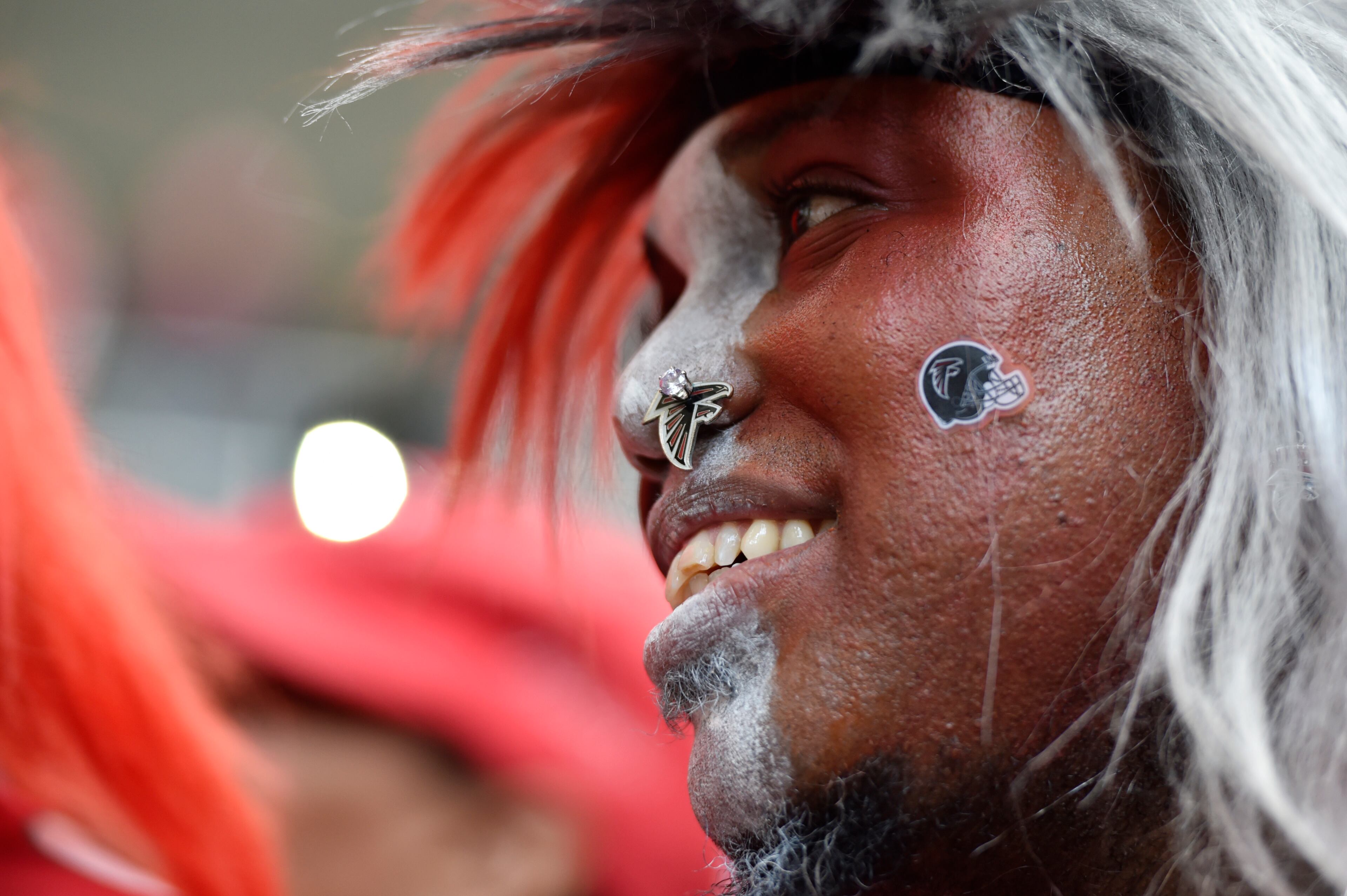 January 20, 2017, Atlanta - A fan listens during a pep rally for the upcoming NFC Championship game against the Packers in Atlanta, Georgia, on Friday, January 20, 2017. (DAVID BARNES / DAVID.BARNES@AJC.COM)