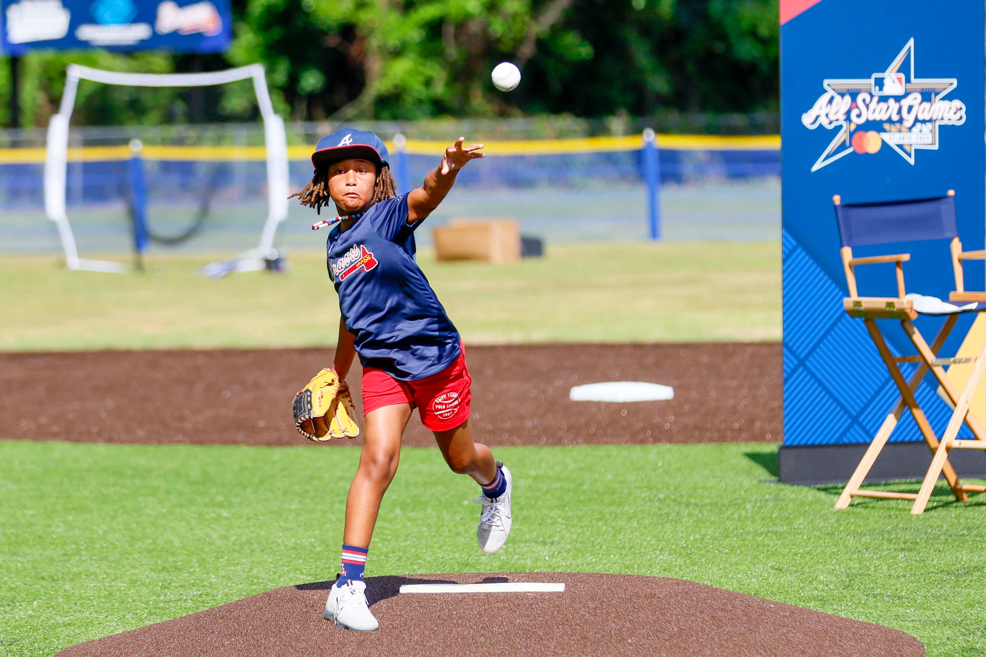 Zahra Rucker (7) throws the inaugural pitch during the unveiling of the new All-Star Legacy Field at the Barksdale Boys & Girls Club in Conyers on Thursday, July 10, 2025. The event takes place during the MLB All-Star Game week in Atlanta.
(Miguel Martinez/ AJC)