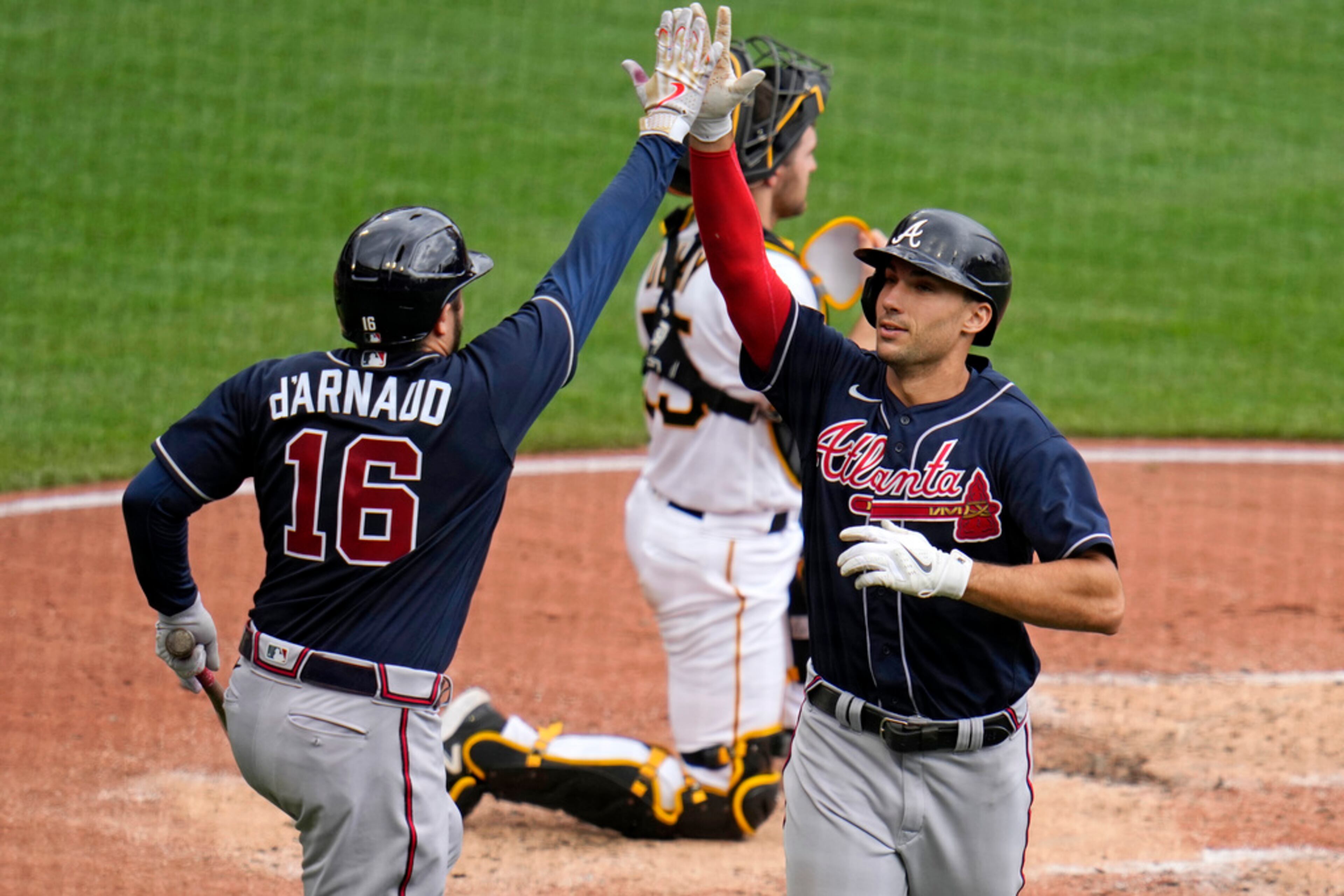 Atlanta Braves' Matt Olson, right, celebrates with Travis d'Arnaud (16) after hitting a solo home run off Pittsburgh Pirates starting pitcher Bailey Falter during the third inning of a baseball game in Pittsburgh, Thursday, Aug. 10, 2023. (AP Photo/Gene J. Puskar)