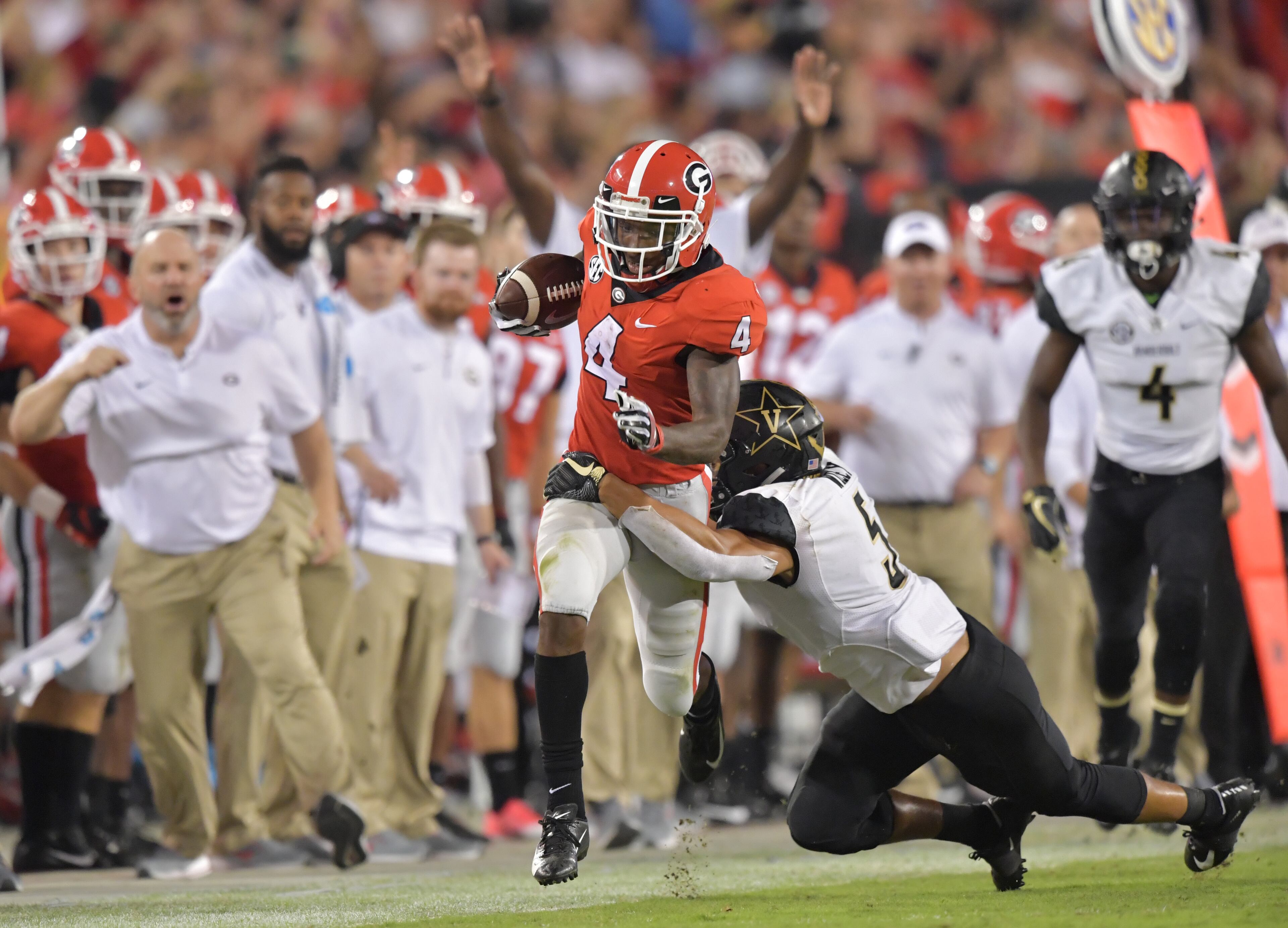 October 6, 2018 Athens - Georgia wide receiver Mecole Hardman (4) gets tackled by Vanderbilt safety LaDarius Wiley (5) in the second half during a NCAA college football game at Sanford Stadium in Athens on Saturday, October 6, 2018. Georgia won 41-13 over the Vanderbilt. HYOSUB SHIN / HSHIN@AJC.COM