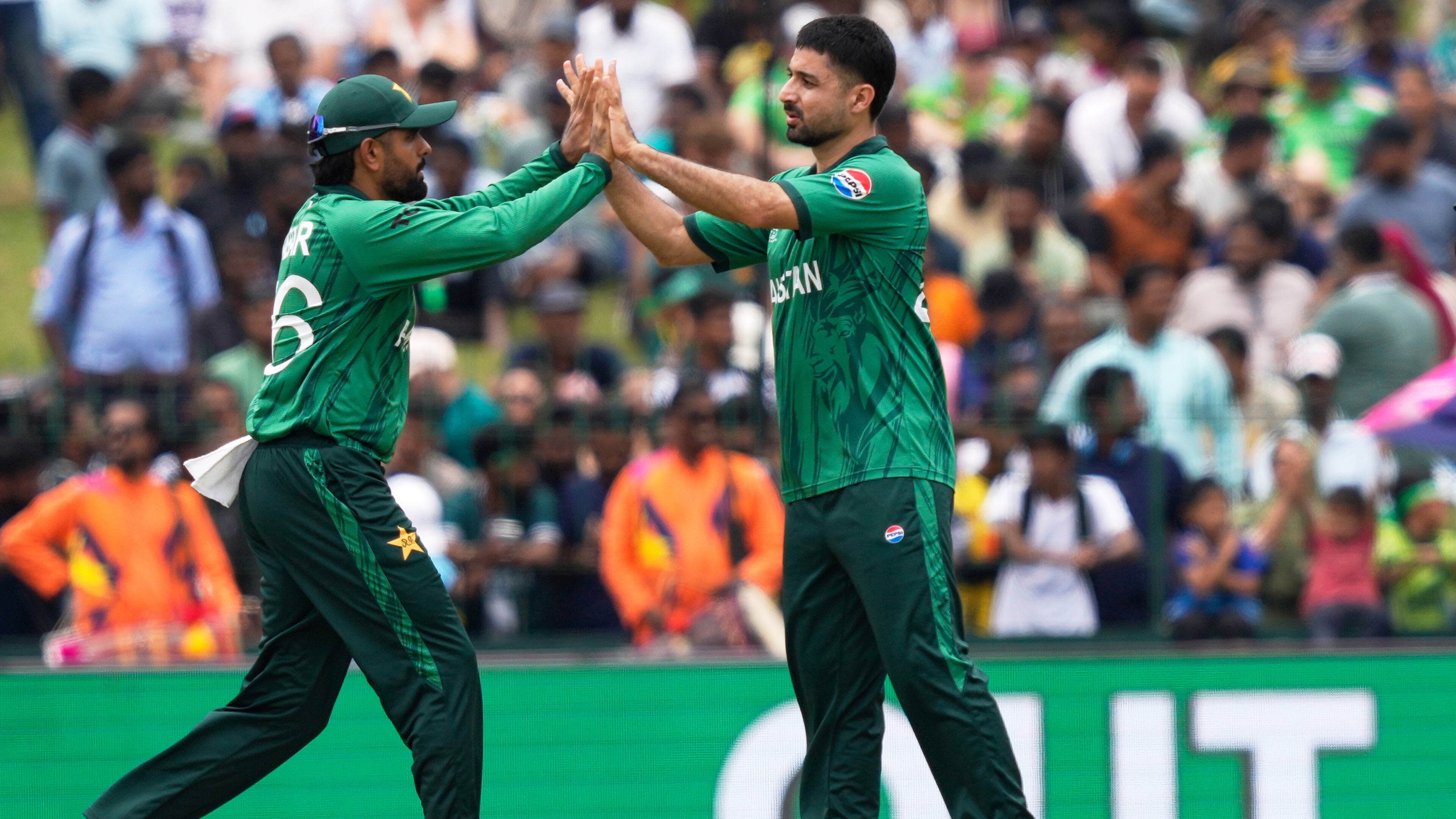 Pakistan's Abrar Ahmed, right, and teammate Babar Azam celebrate the wicket of Netherlands' captain Scott Edwards during the T20 World Cup cricket match between Netherlands and Pakistan in Colombo, Sri Lanka, Saturday, Feb. 7, 2026. (AP Photo/Eranga Jayawardena)