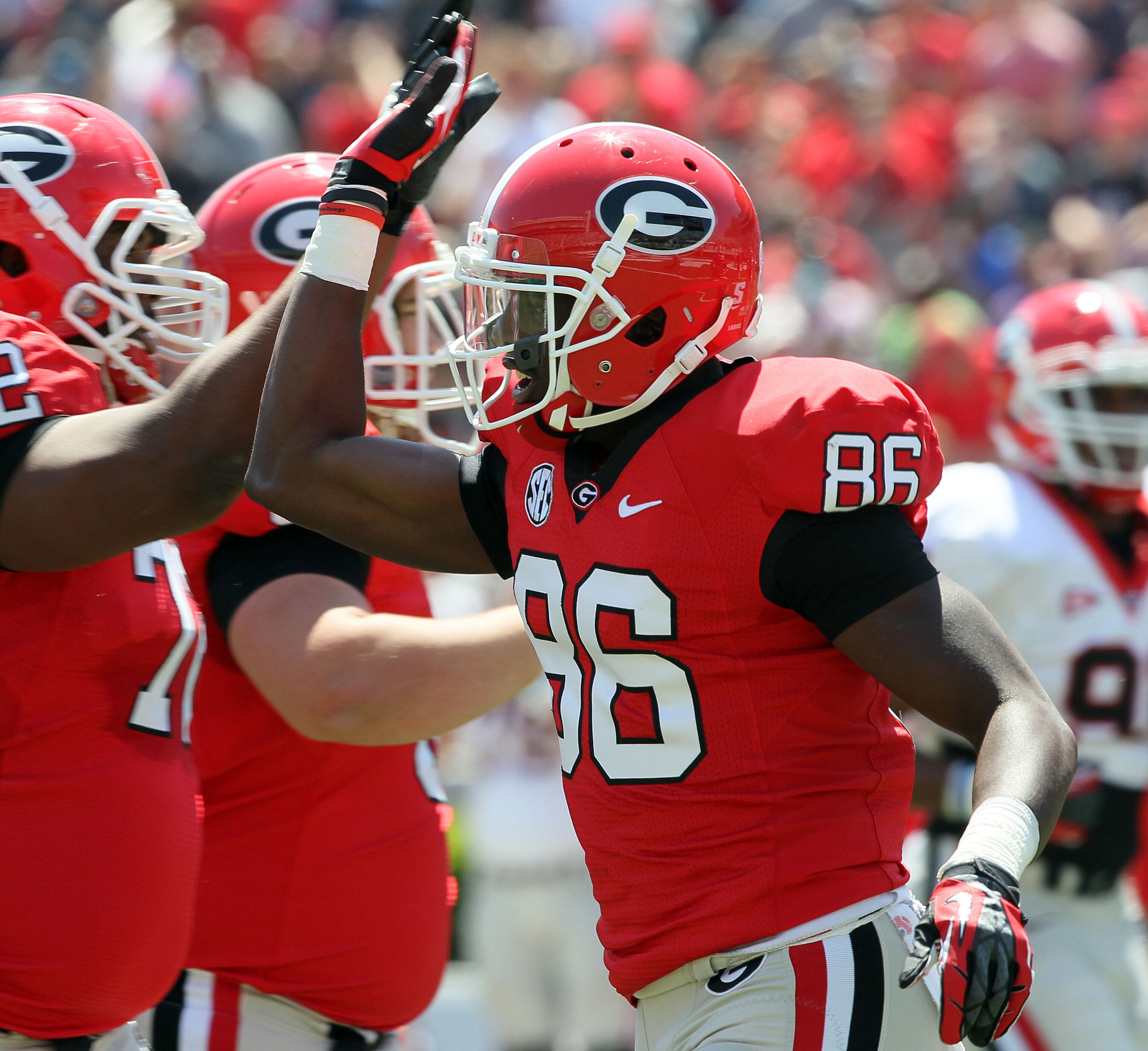 #86 Justin Scott-Wesley is congratulated after he score a touchdown.