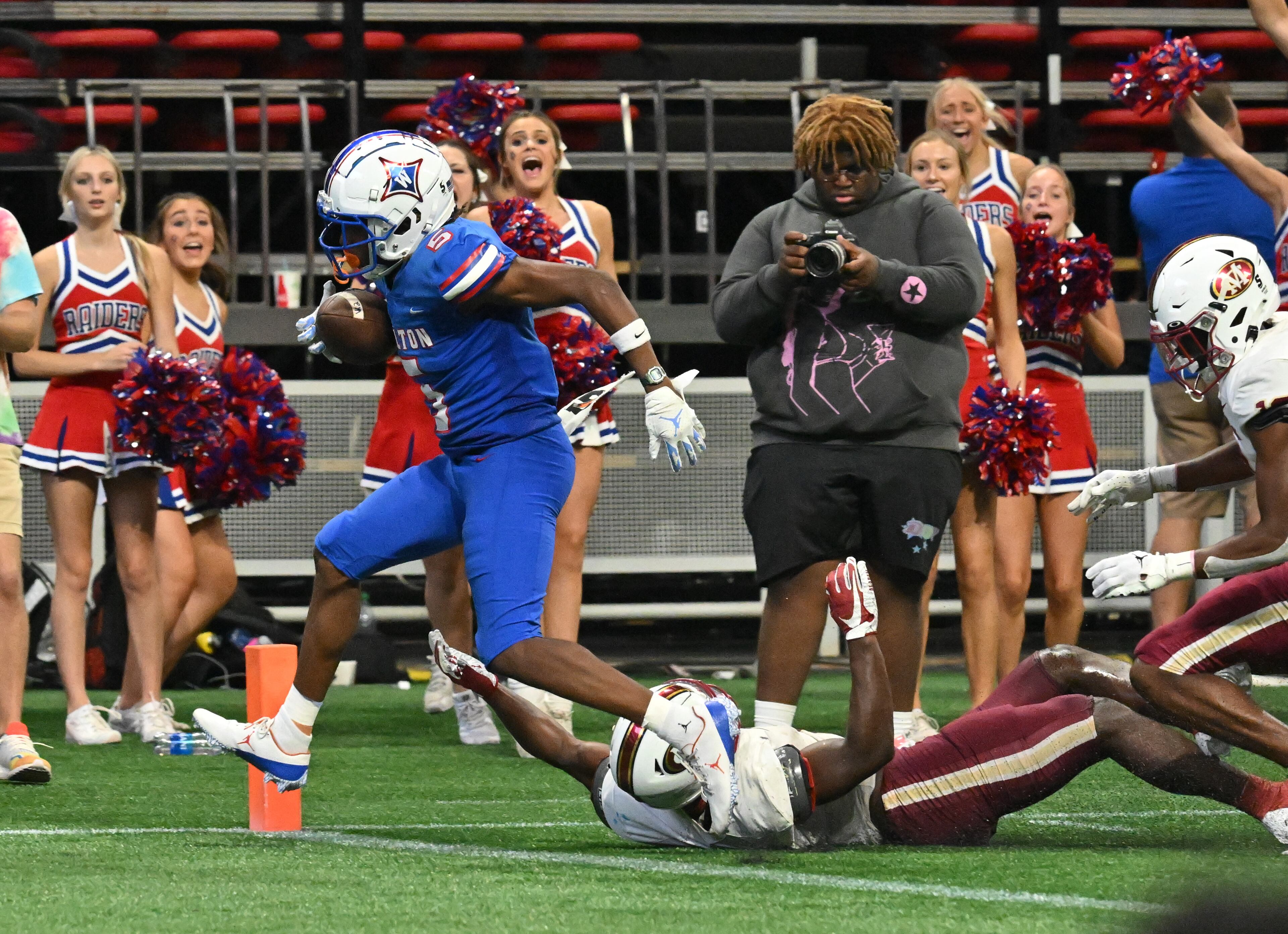 August 20 , 2022 Atlanta - Walton's Ayden Jackson (5) scores a touchdown pass over Mill Creek's Caleb Downs (2) during the 2022 Corky Kell Classic at Mercedes Benz Stadium on Saturday, August 20, 2022. Mill Creek won 44-41 over Walton. (Hyosub Shin / Hyosub.Shin@ajc.com)