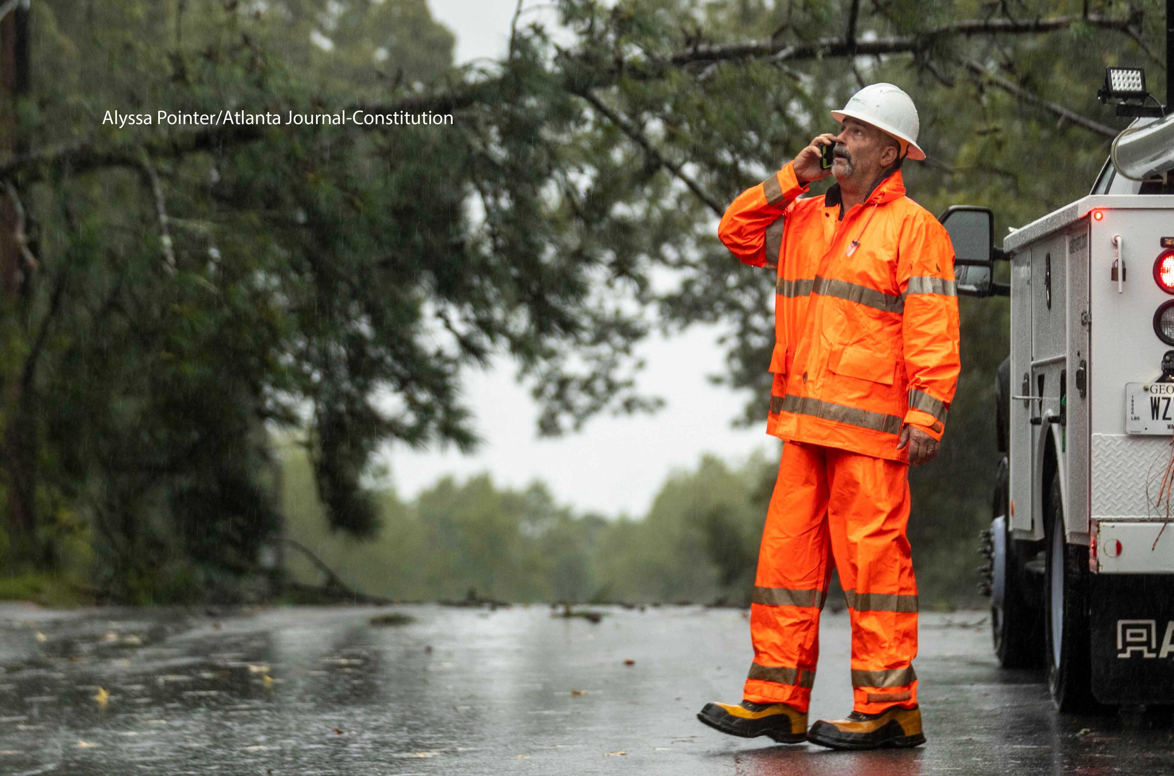 John Wanek, crew lead with Walton EMC, assess a power line that was damaged by a fallen tree on Valley Dale Drive SW in Lilburn, Georgia.
2 files