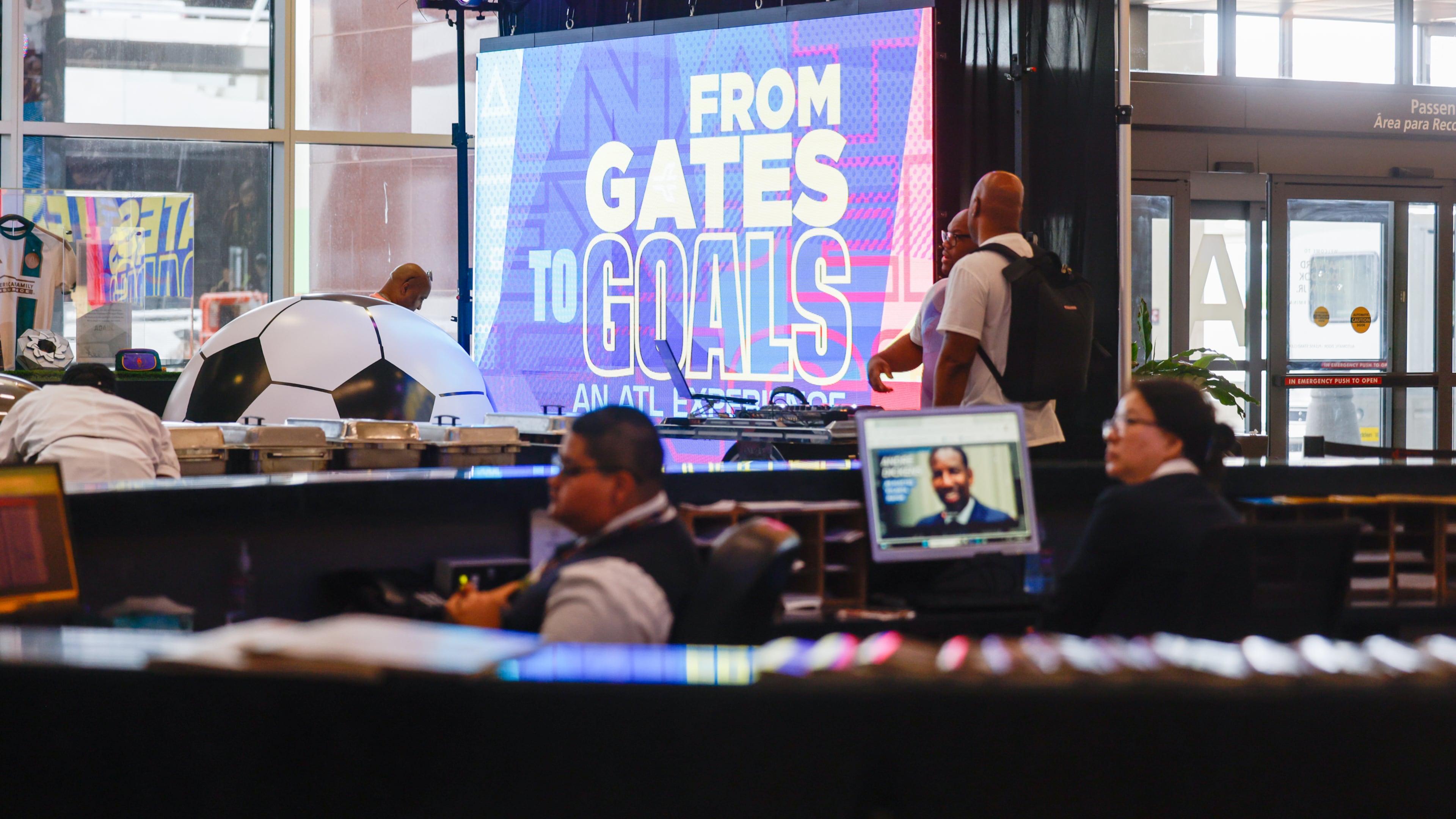 A screen marks the "From Gates to Goals" exhibit celebrating the upcoming FIFA World Cup at Hartsfield-Jackson Atlanta International Airport's international terminal in Atlanta on May 27, 2026. (Arvin Temkar/AJC)
