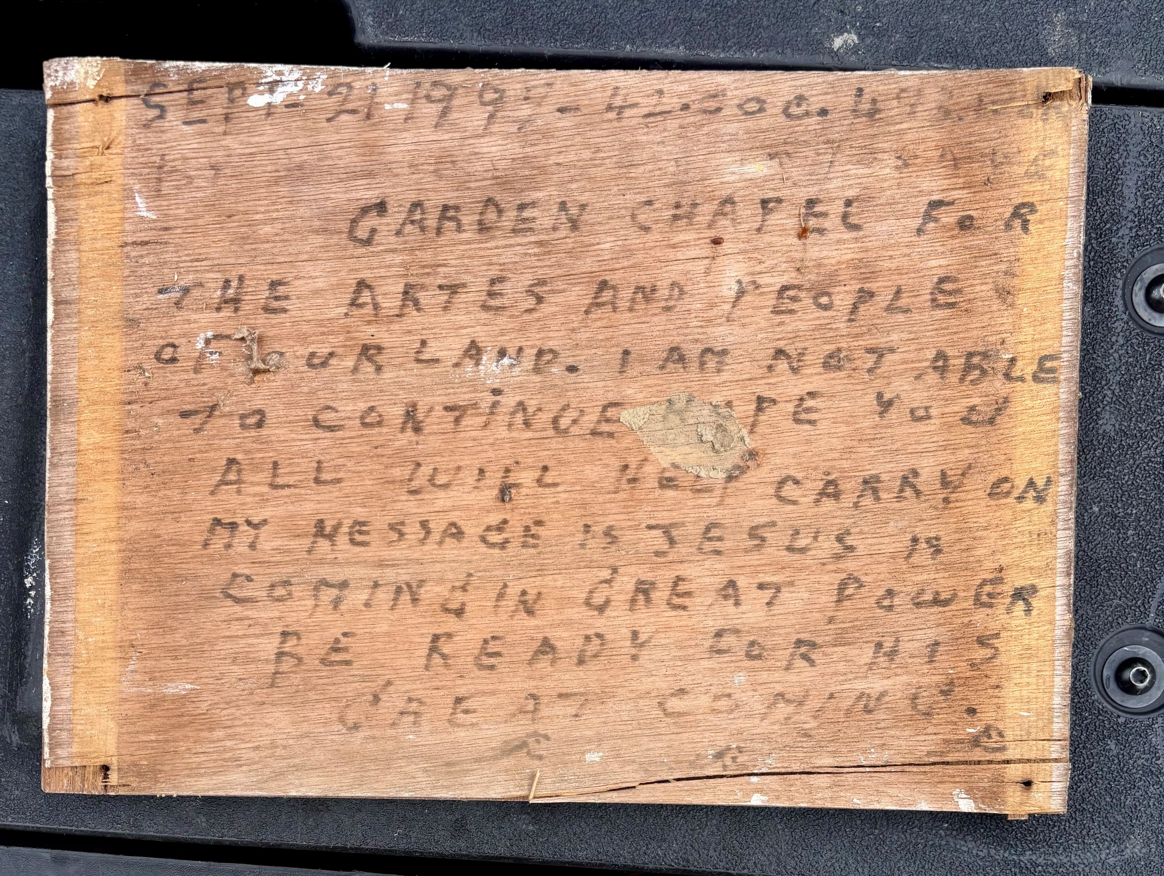 A sign hung on the front door of Howard Finster's World's Folk Art Church telling visitors that he had to close the church. Courtesy of Eddy Willingham