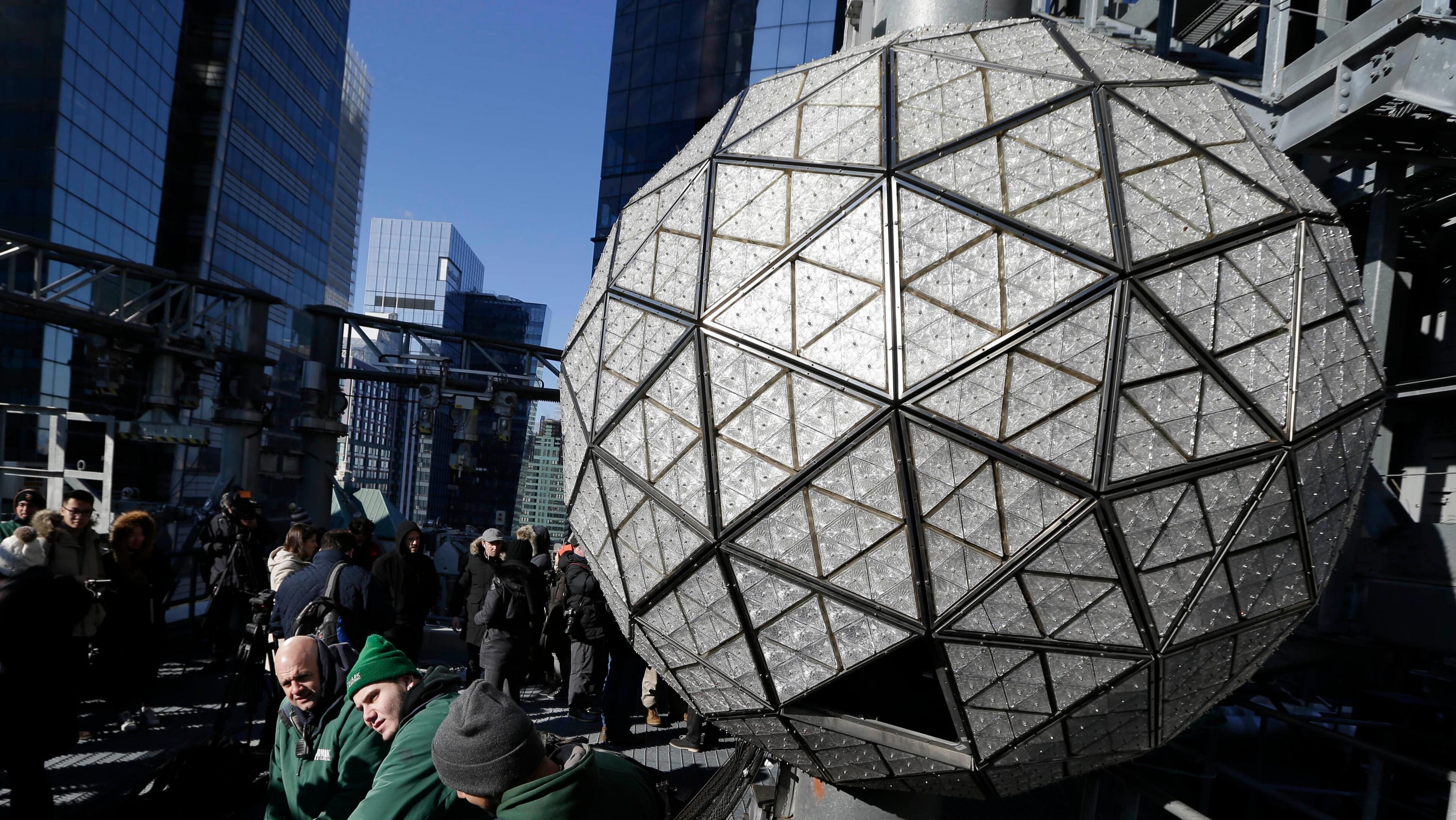 Workers prepare to install the last panels on the New Year's Eve ball above Times Square, New York, Wednesday, Dec. 27, 2017. The 12-foot diameter ball carries over 2600 Waterford crystals and is lit by more than 32,000 LEDs.