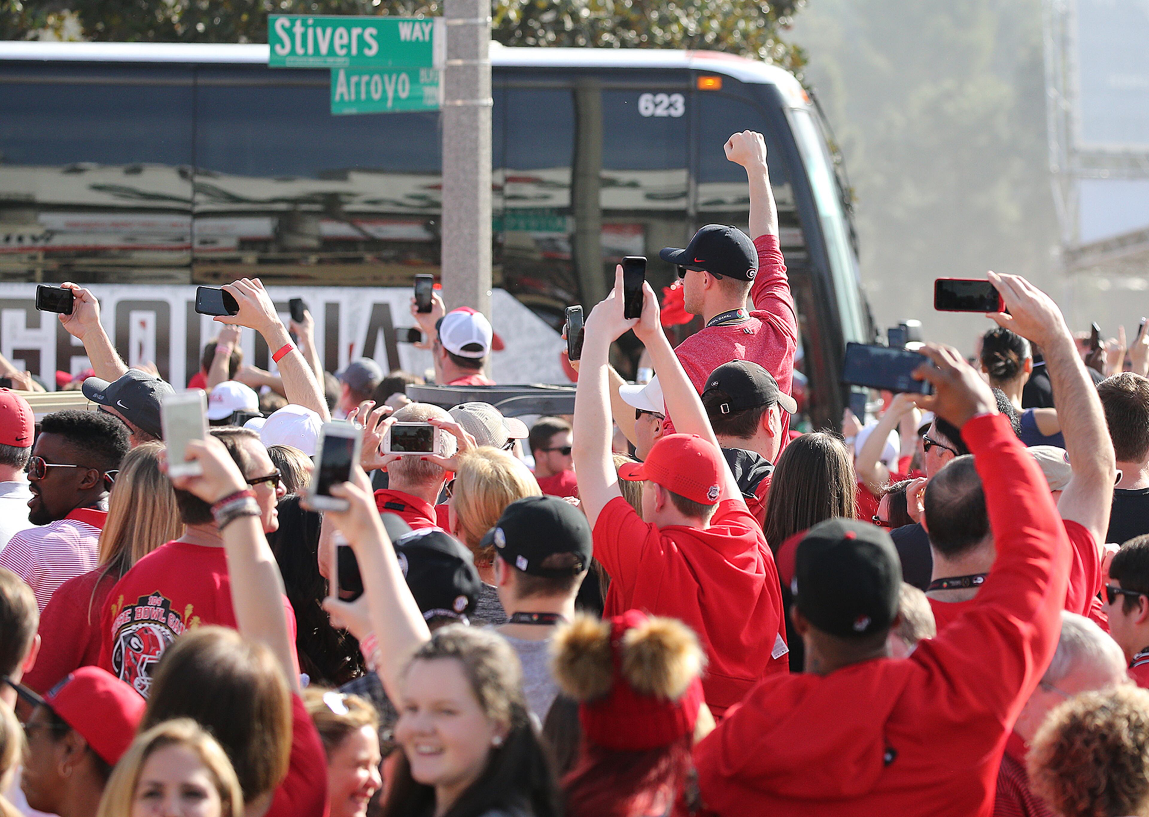 January 1, 2018 Pasadena: Georgia fans cheer their team as their buses arrive for the College Football Playoff Semifinal against Oklahoma at the Rose Bowl Game on Monday, January 1, 2018, in Pasadena. Curtis Compton/ccompton@ajc.com