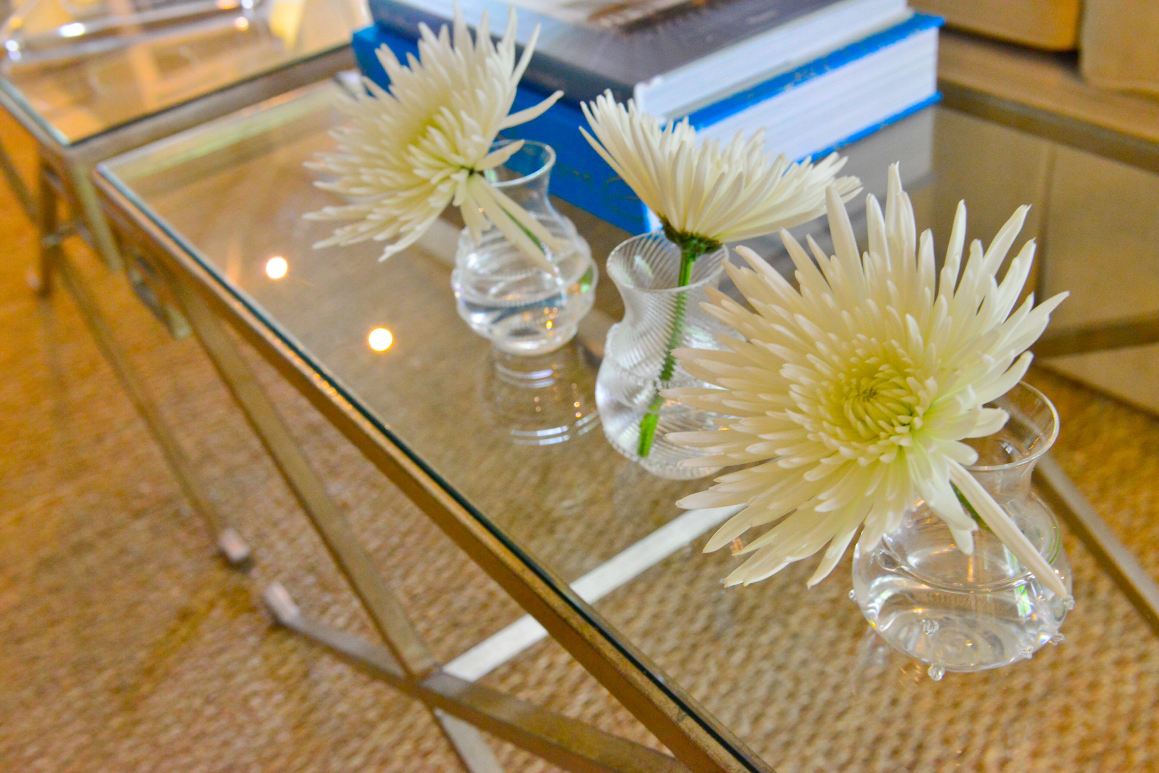 Contemporary touches in the Buckhead home include glass top tables with gold legs by Bernhardt.