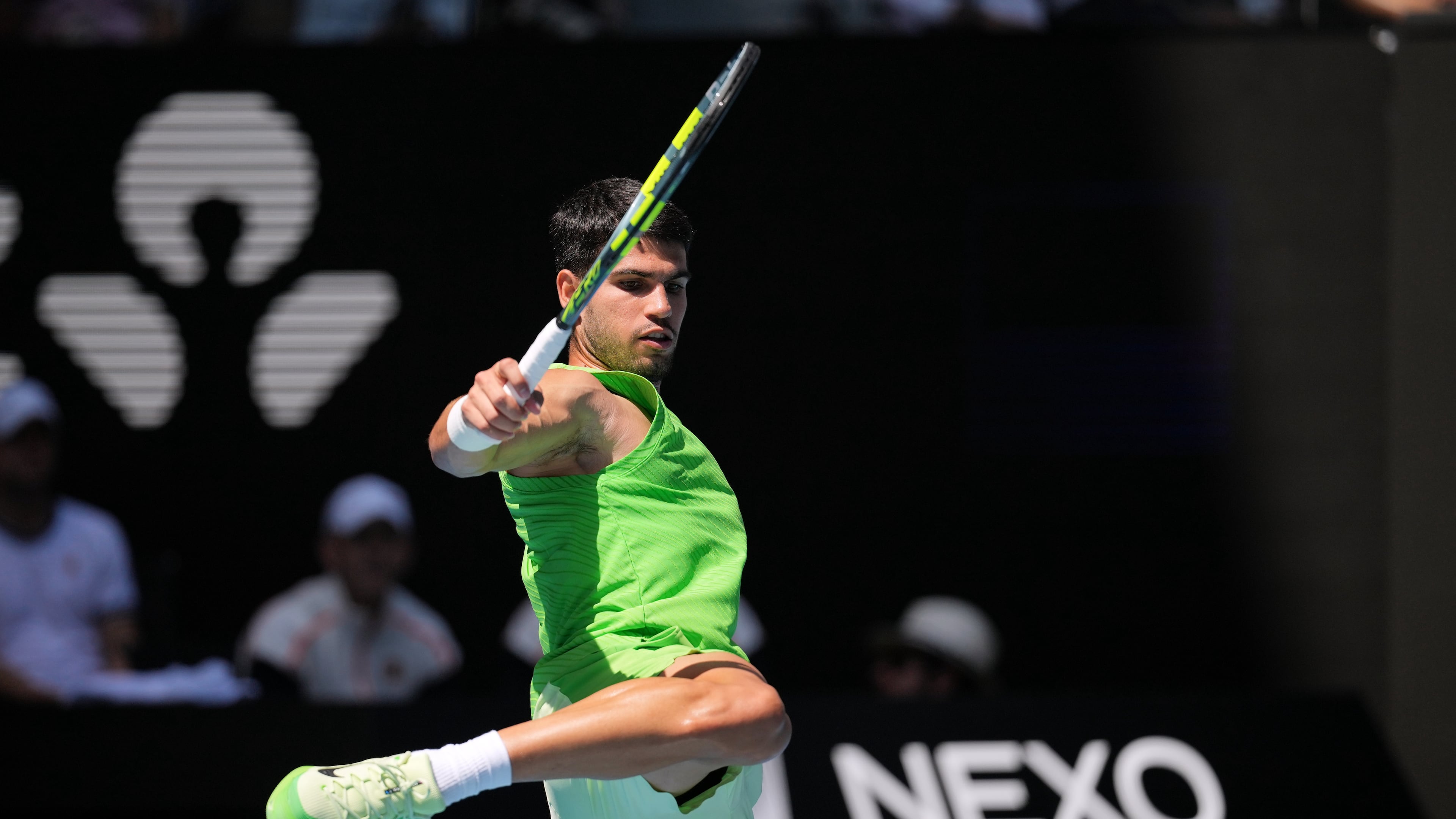 Carlos Alcaraz of Spain kicks the ball during his fourth round match against Tommy Paul of the U.S. at the Australian Open tennis championship in Melbourne, Australia, Sunday, Jan. 25, 2026. (AP Photo/Dita Alangkara)