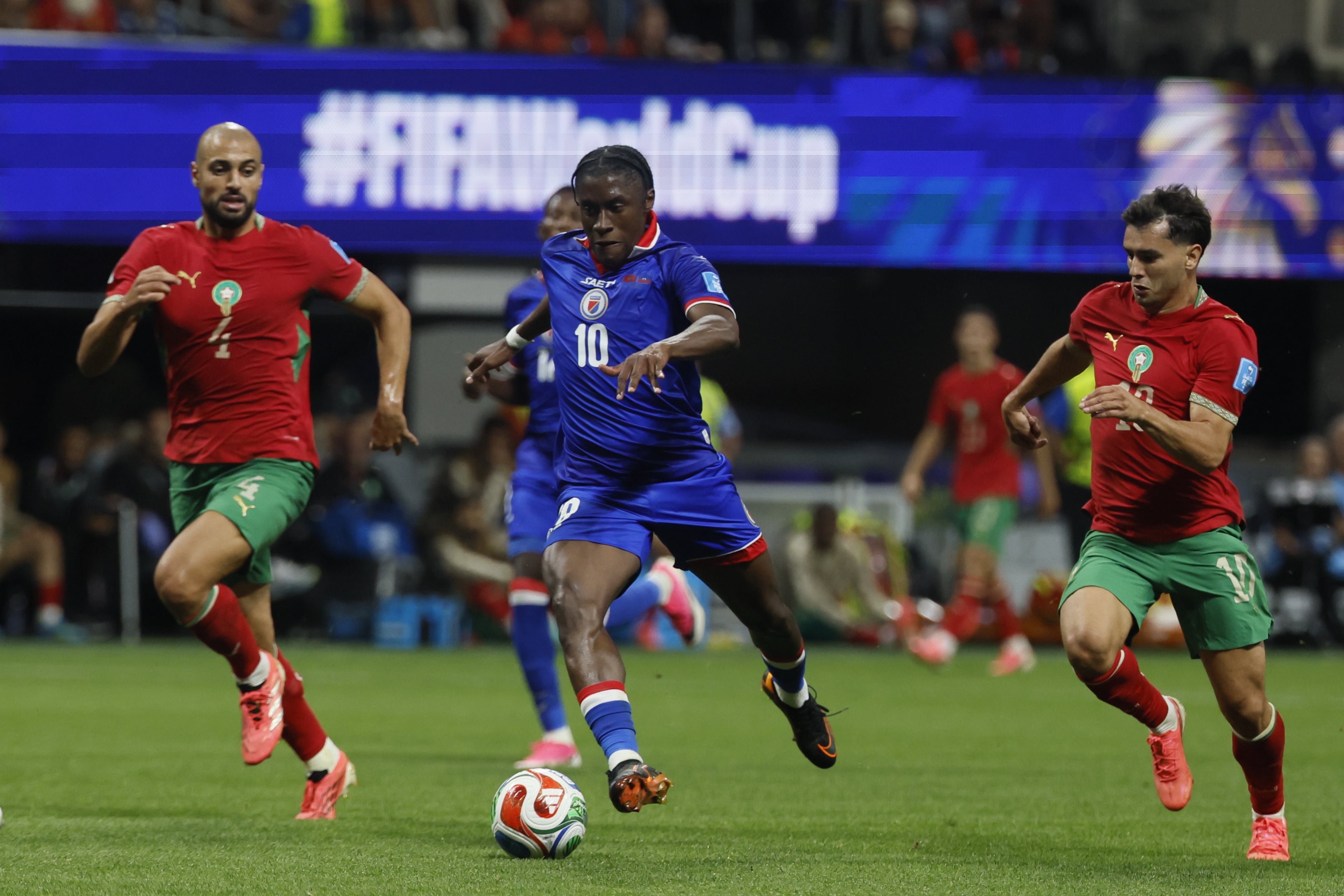 Haiti's Jean-Ricner Bellegarde, center, controls the ball between, Morocco's Sofyan Amrabat, left and Morocco's Brahim Diaz, right, during second half of Morocco vs. Haiti Group C FIFA World Cup match at Atlanta Stadium (Mercedes-Benz Stadium) on Wednesday, June 24, 2026. (Miguel Martinez/AJC)