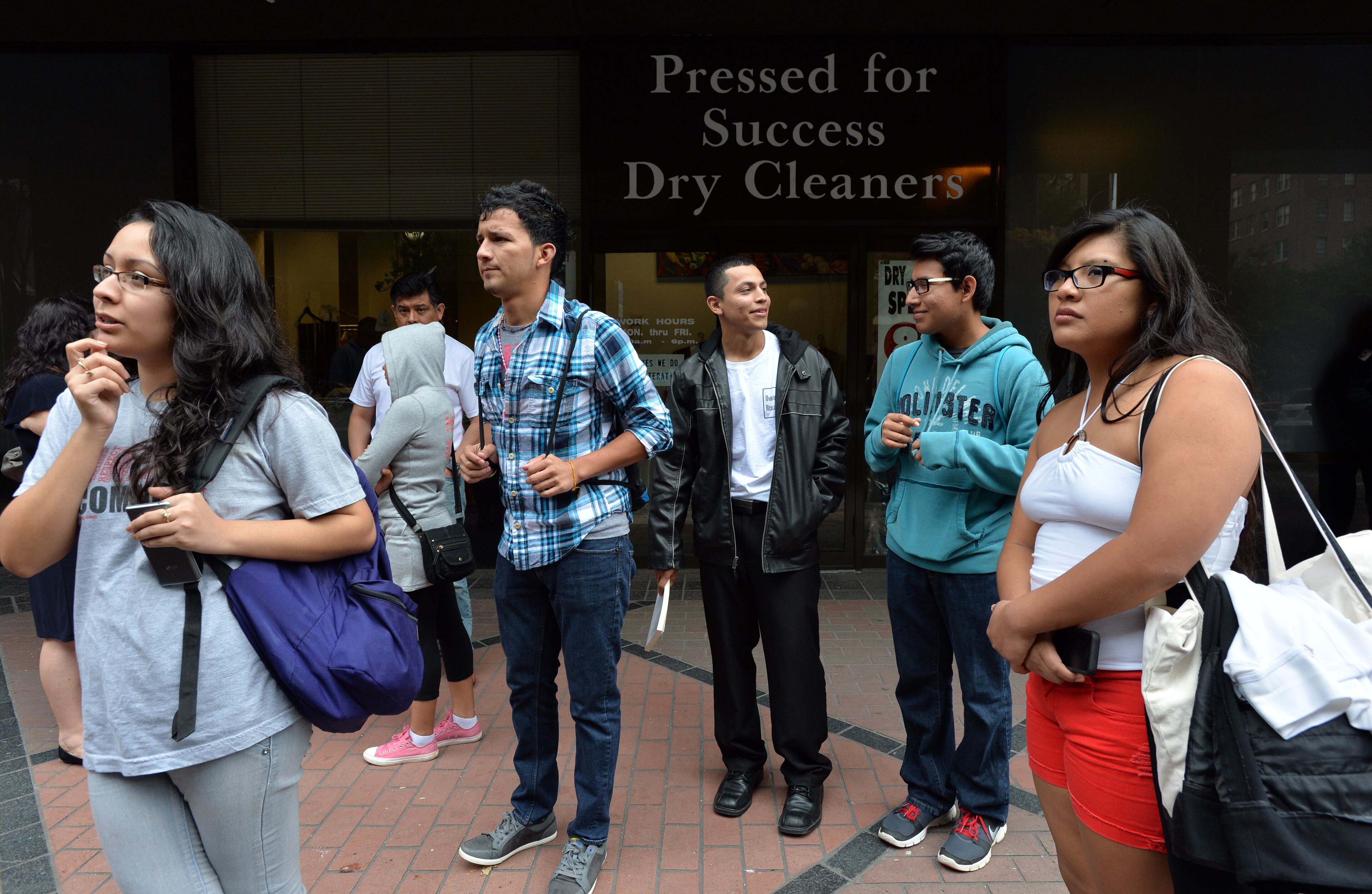 Atlanta - Yovany Diaz (center) and other supporters gather to support Jonathan Zuniga, who is a Dreamer from Buford and left to Mexico after his high school graduation, near Representative John Lewis office in downtown Atlanta on Tuesday, October 15, 2013. Diaz, who was 8 years old at the time, now lives with his mother in Roswell and works at a local discount warehouse store. "It was very dark. The water was cold," said Diaz, who has received a two-year reprieve from deportation. Diaz, who dreams of becoming a social worker, worries the border security legislation could prompt more immigrants to cross dangerous stretches of remote terrain. HYOSUB SHIN / HSHIN@AJC.COM