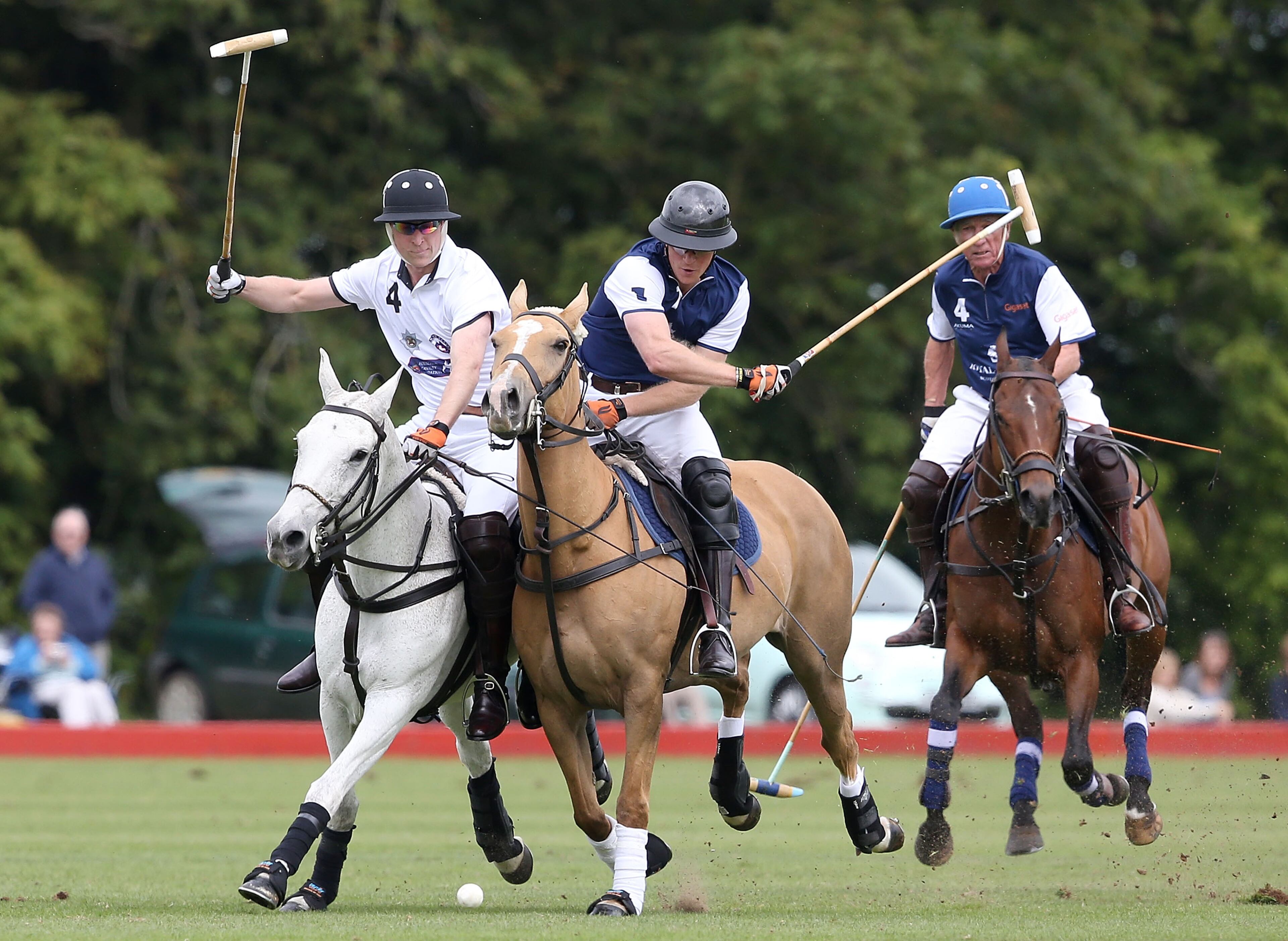 Prince Harry plays for team Royal Salute and Prince William, Duke of Cambridge plays for team Piaget at the Gigaset Charity Polo Match at Beaufort Polo Club on June 14, 2015 in Tetbury, England. (Photo by Chris Jackson/Getty Images for Gigaset Mobile)